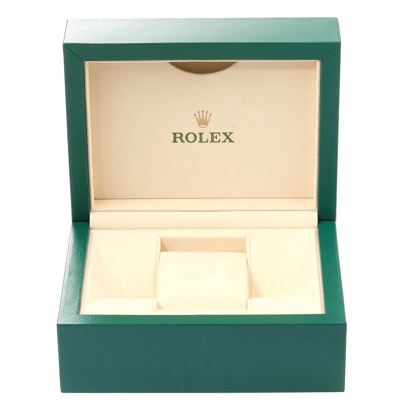 The image shows an open green and beige Rolex watch box for the Datejust model.
