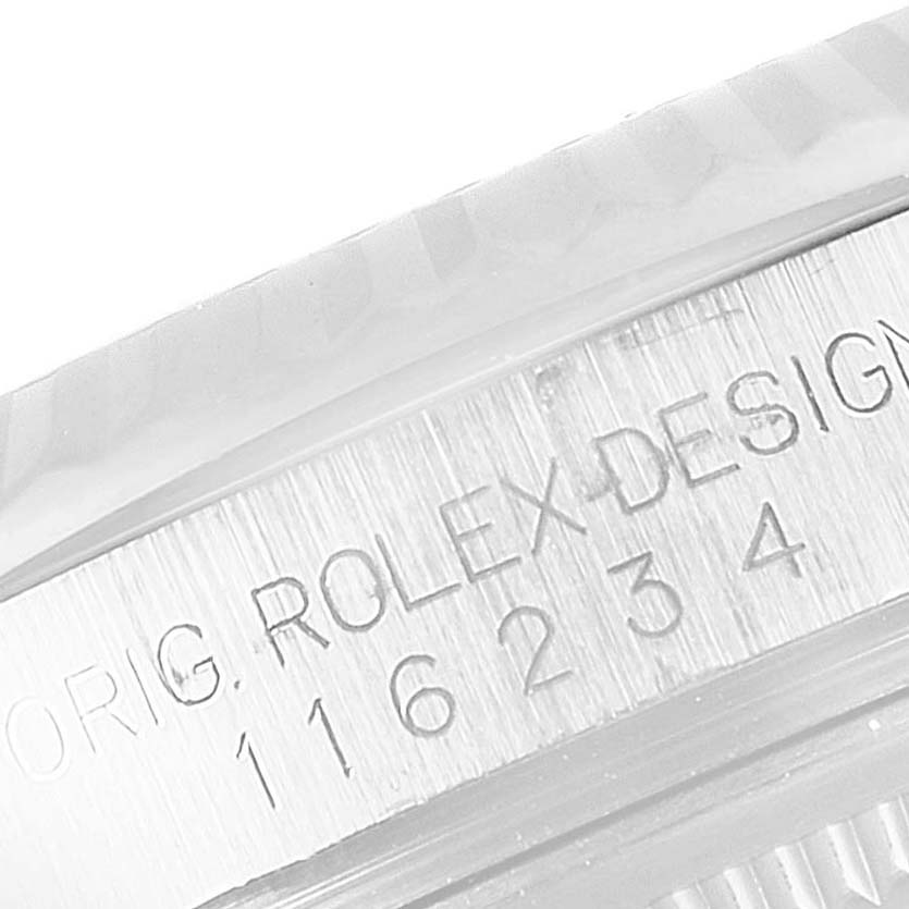 This close-up image shows the engraved model number on the case of a Rolex Datejust 116234 Men's Stainless Steel Black Dial 116234 Men's Stainless Steel Black Dial watch.