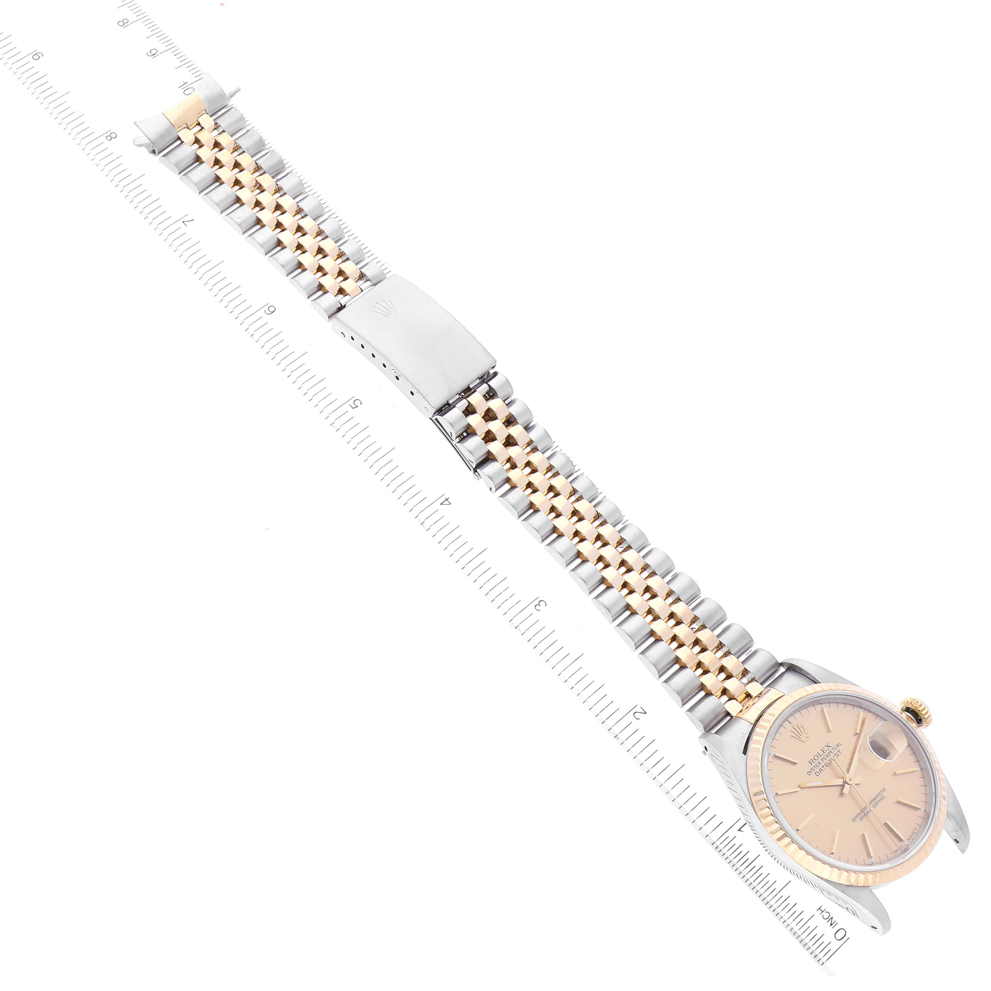 The image shows a Rolex Datejust 16233 Men's Steel and Gold (two tone) Champagne Dial 16233 Men's Steel and Gold (two tone) Champagne Dial watch laid flat, displaying the face, bezel, and metal bracelet with Jubilee design.
