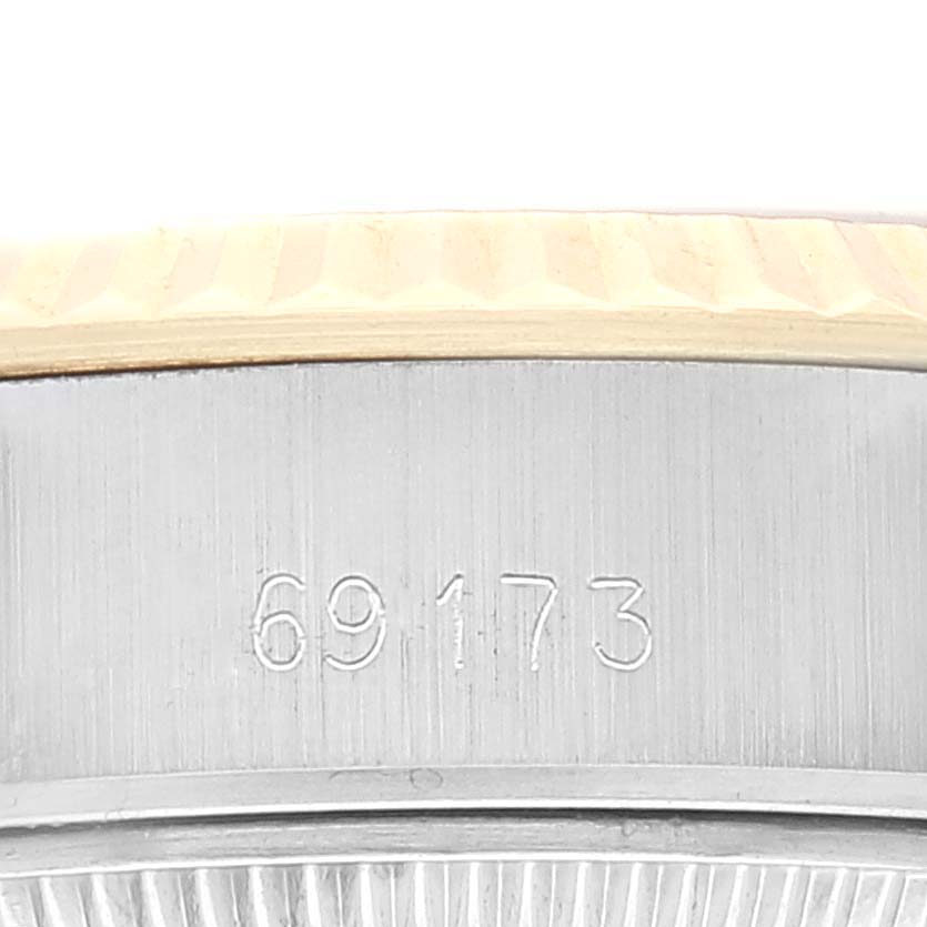 This image shows a close-up of the side of the Rolex Datejust 69173 Women's Steel and Gold (two tone) Champagne Dial 69173 Women's Steel and Gold (two tone) Champagne Dial watch, specifically the model number 69173 engraved on the case.