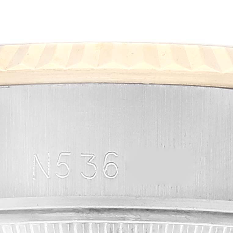 This image shows a close-up, side view of the bezel and case of a Rolex Datejust 69173 Women's Steel and Gold (two tone) Champagne Dial 69173 Women's Steel and Gold (two tone) Champagne Dial watch.