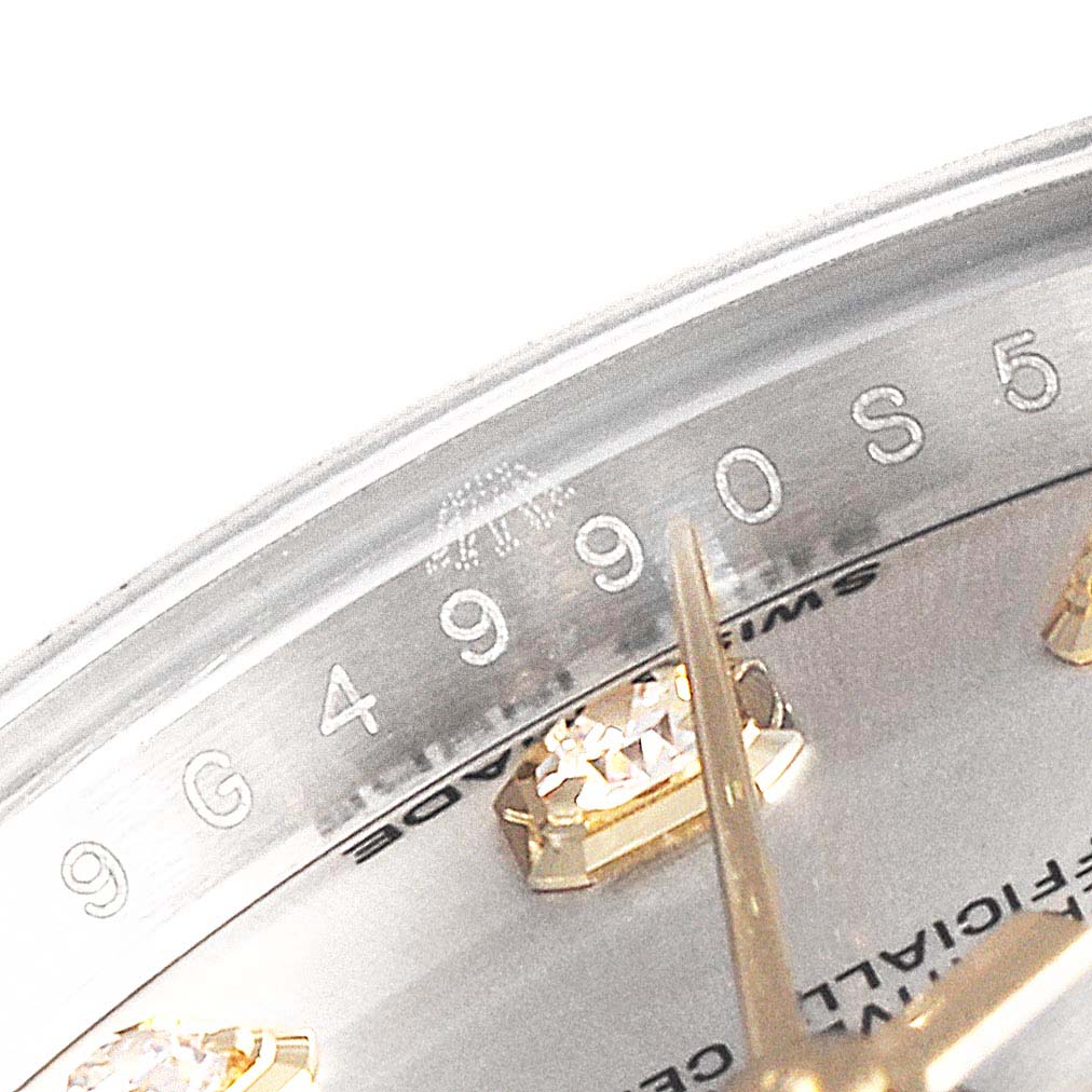 The image shows a close-up of the dial and bezel of a Rolex Datejust 179383 Women
s Steel and Gold (two tone) Silver Dial 179383 Women
s Steel and Gold (two tone) Silver Dial, highlighting the serial number and some hour markers.