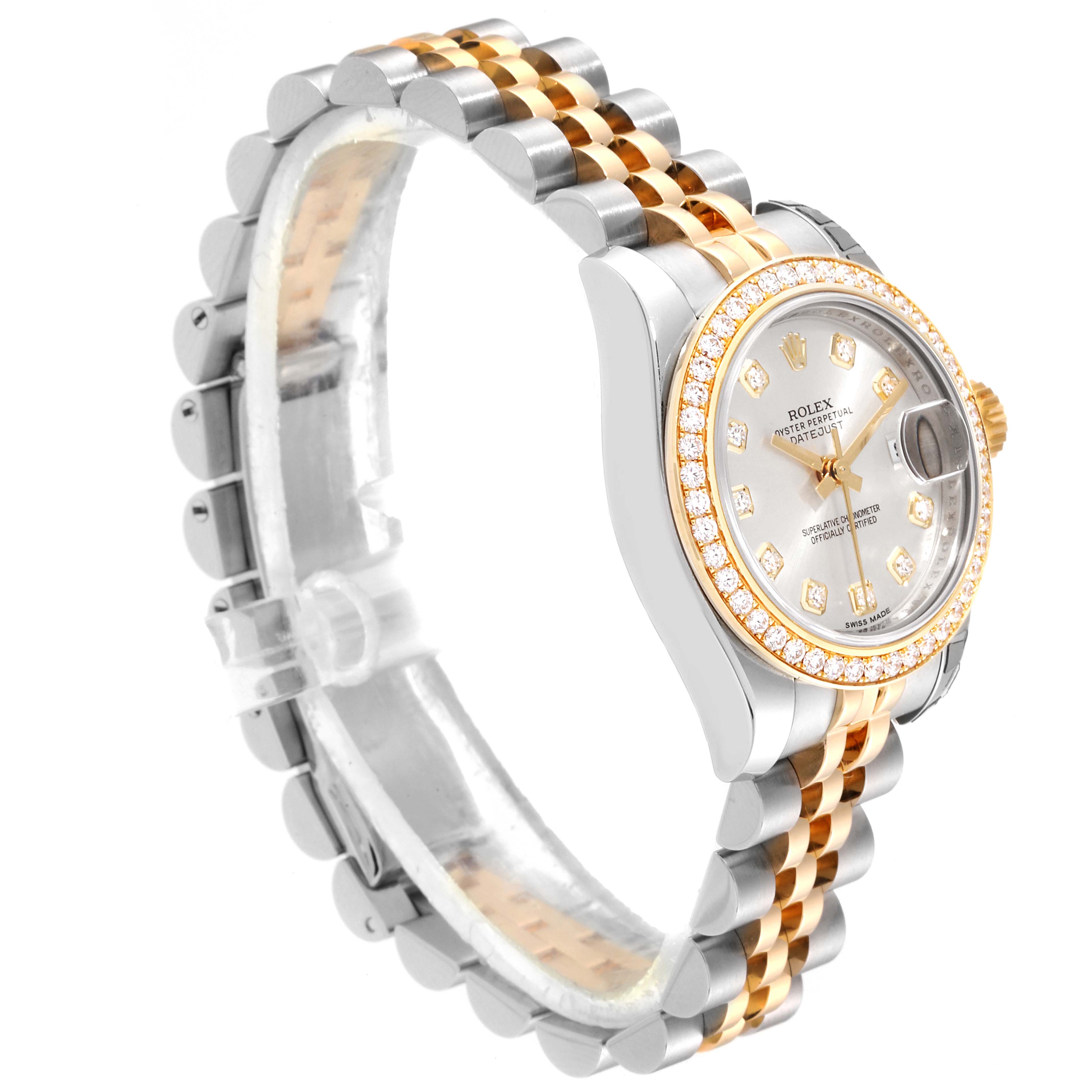 The image shows a side angle of a Rolex Datejust 179383 Women
s Steel and Gold (two tone) Silver Dial 179383 Women
s Steel and Gold (two tone) Silver Dial watch, highlighting its gold and silver band, and diamond-set bezel and dial.