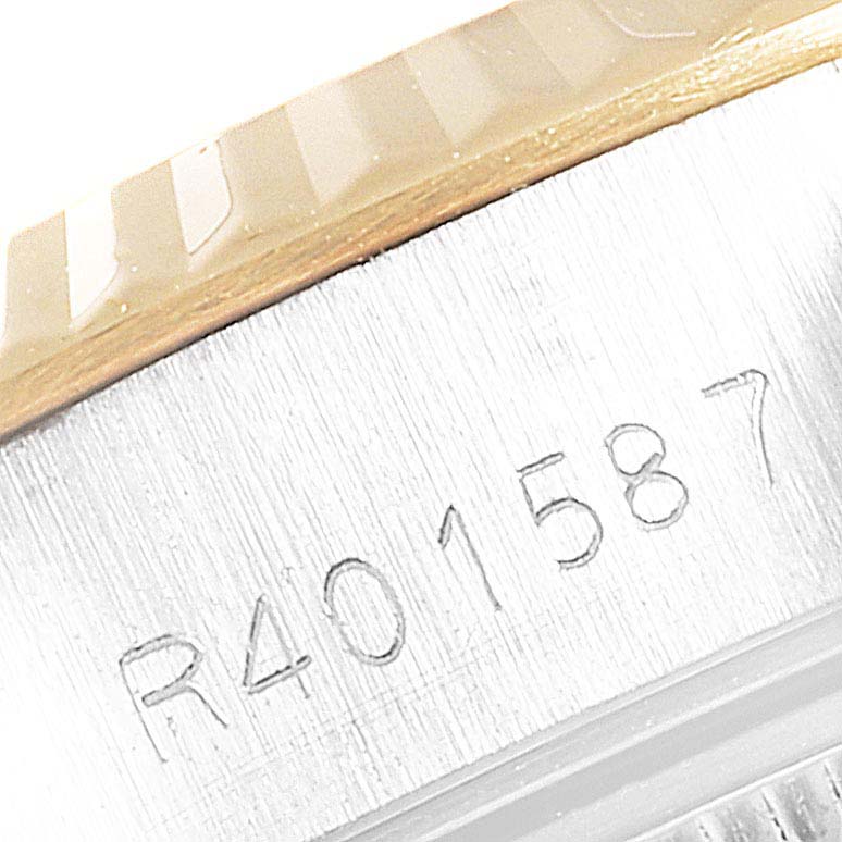 This is a close-up of the serial number engraving on the case of a Rolex Datejust 69173 Women
s Steel and Gold (two tone) Champagne Dial 69173 Women
s Steel and Gold (two tone) Champagne Dial watch.
