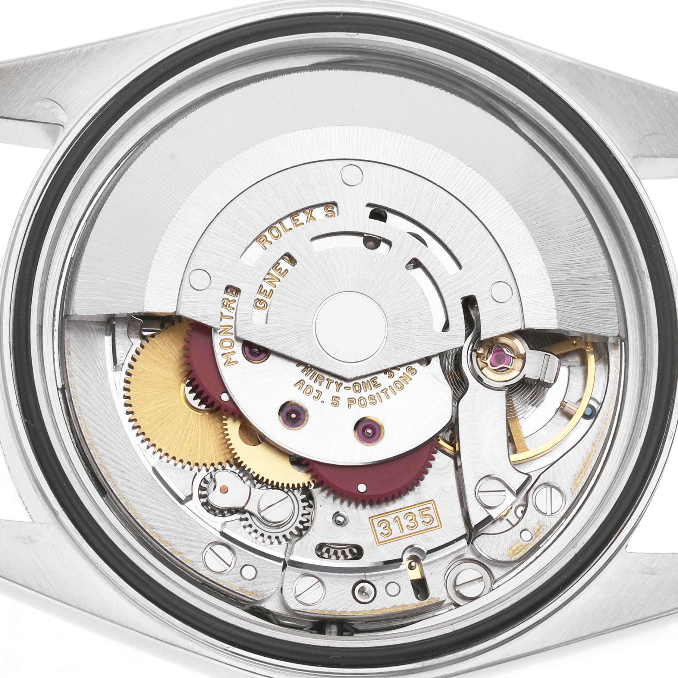 This image shows the internal movement of a Rolex Datejust 16203 Men's Steel and Gold (two tone) Silver Dial, focusing on the intricate gears and mechanical components.