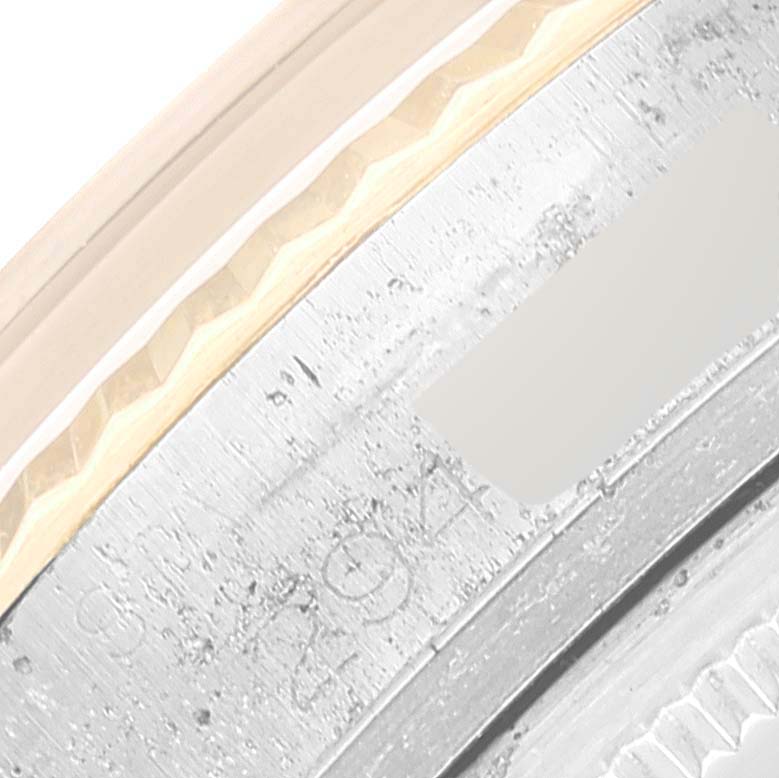 This close-up photo shows the serial engraving on the case of a Vintage Collection model by Rolex.