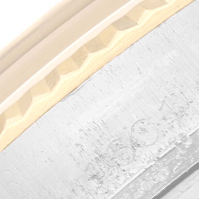 The image shows a close-up of the edge of a Rolex Vintage Collection 1601 Men's Steel and Gold (two tone) Silver Dial 1601 Men's Steel and Gold (two tone) Silver Dial watch, highlighting the bezel and part of the case.