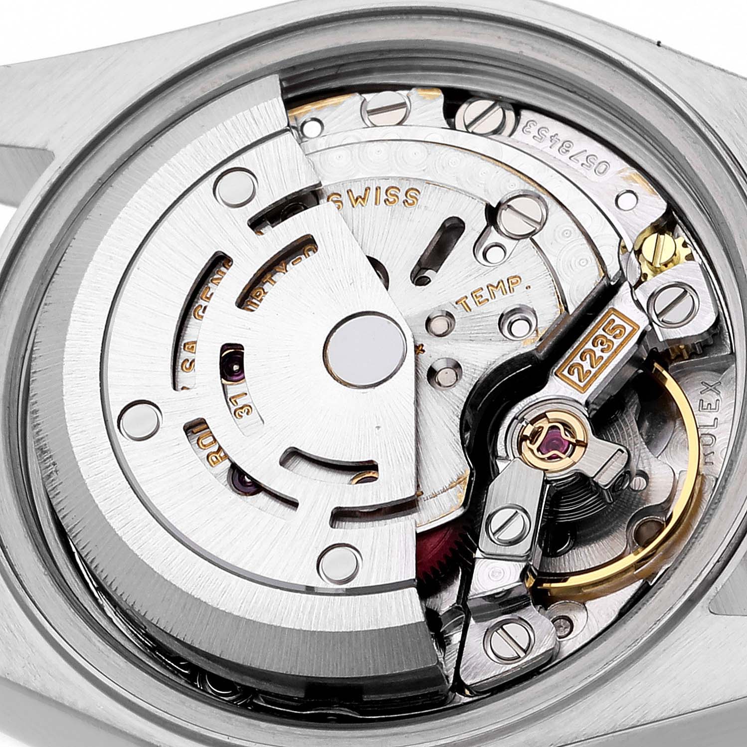 This image shows the interior mechanism of a Rolex Datejust 79173 Women's Steel and Gold (two tone) Grey Dial 79173 Women's Steel and Gold (two tone) Grey Dial watch, viewed from the back with visible gears and rotor.