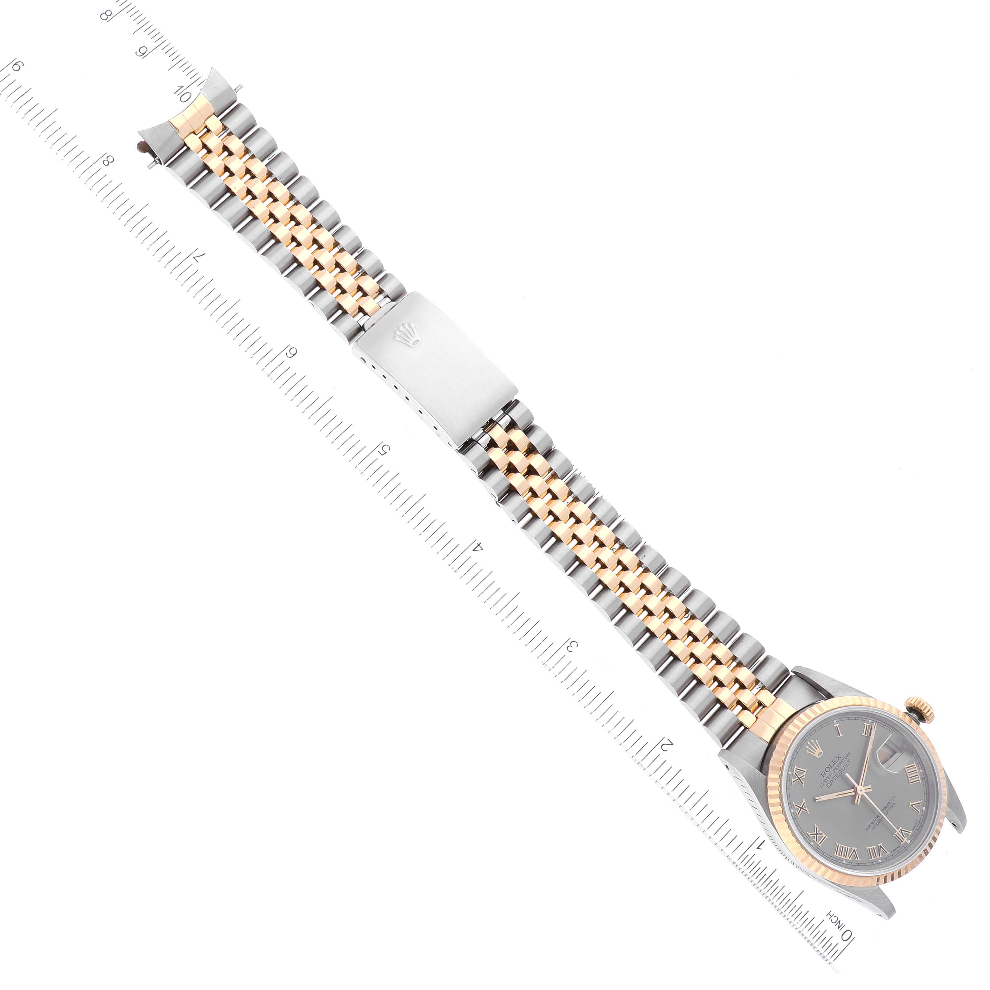 The image shows a Rolex Datejust 16233 Men's Steel and Gold (two tone) Grey Dial 16233 Men's Steel and Gold (two tone) Grey Dial watch viewed from the top, displaying the face, bezel, and full bracelet with a ruler for scale.