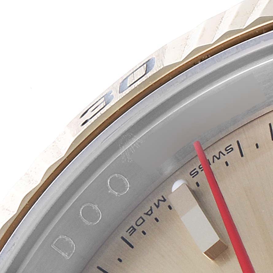 This close-up image shows the bezel, dial, and part of the second hand of the Rolex Turn-o-Graph 116263 Men
s Steel and Gold (two tone) Champagne Dial 116263 Men
s Steel and Gold (two tone) Champagne Dial watch.