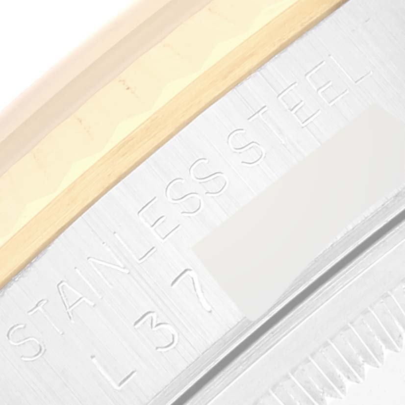 This image shows a close-up view of the side of a Rolex Datejust 16233 Men's Steel and Gold (two tone) White Dial 16233 Men's Steel and Gold (two tone) White Dial watch, highlighting the "STAINLESS STEEL" engraving.