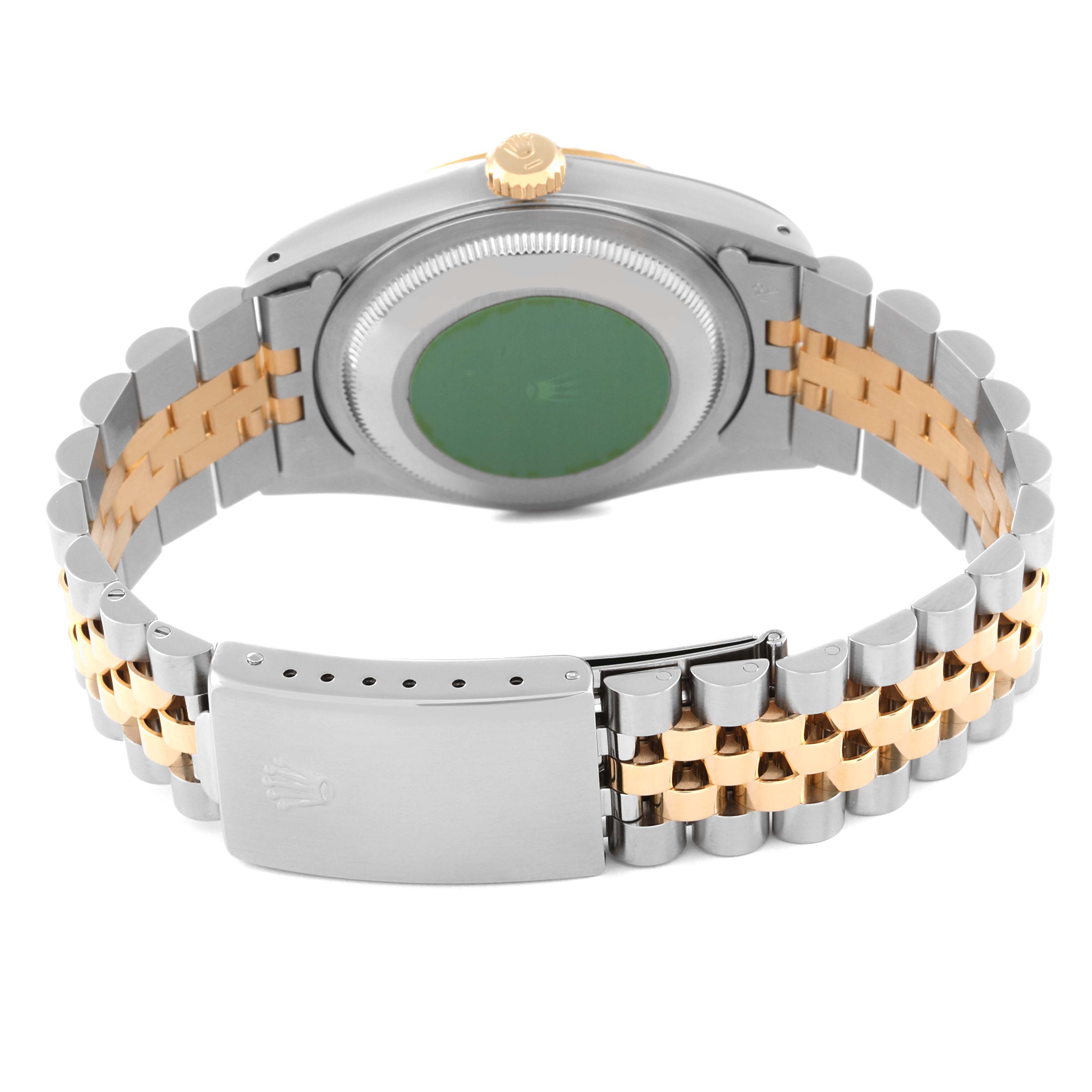 The image shows the back view of a Rolex Datejust 16233 Men's Steel and Gold (two tone) White Dial 16233 Men's Steel and Gold (two tone) White Dial watch, highlighting the case, crown, and two-tone jubilee bracelet with a clasp.