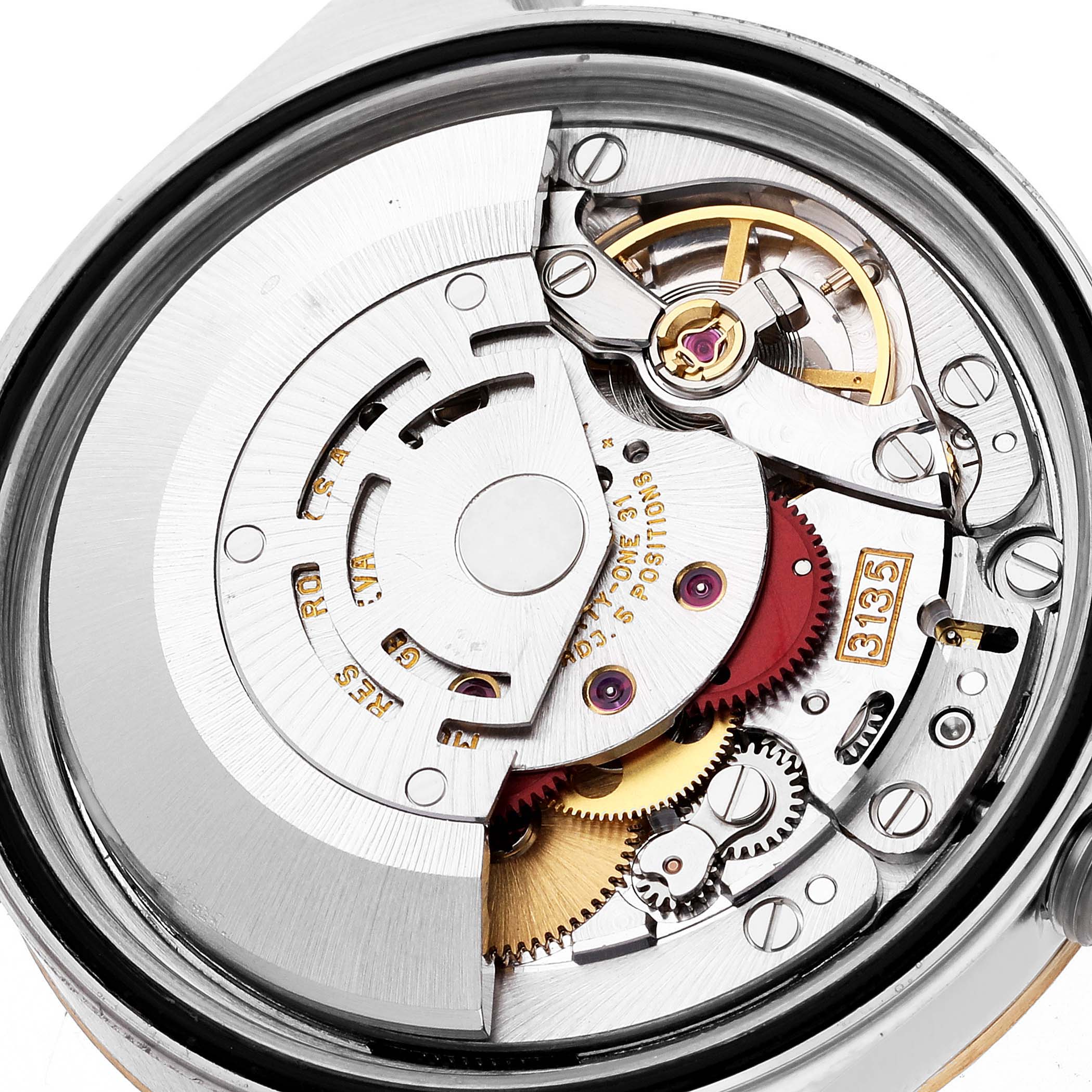 This image shows an internal view of the mechanical movement of a Rolex Datejust 16233 Men's Steel and Gold (two tone) White Dial 16233 Men's Steel and Gold (two tone) White Dial watch at a close-up angle.