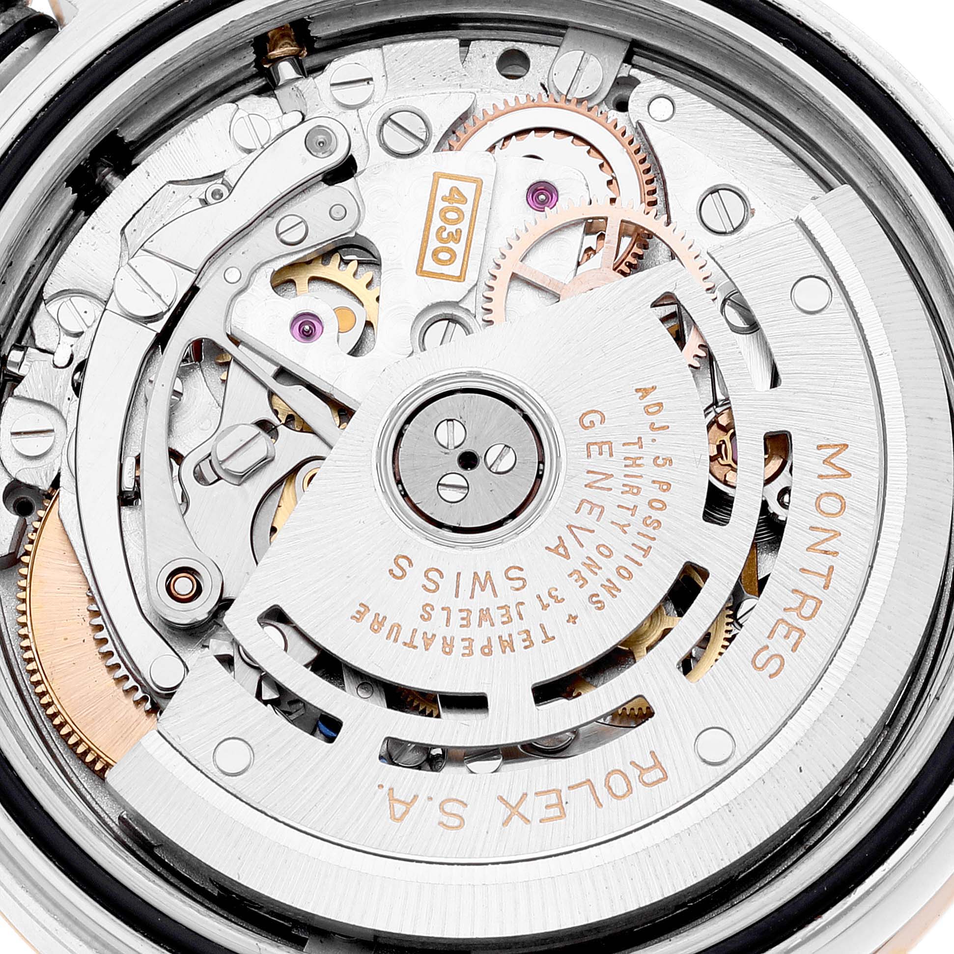 The image shows an up-close view of the Rolex Daytona 16523 Men's Steel and Gold (two tone) Champagne Dial 16523 Men's Steel and Gold (two tone) Champagne Dial watch movement and inner mechanisms.