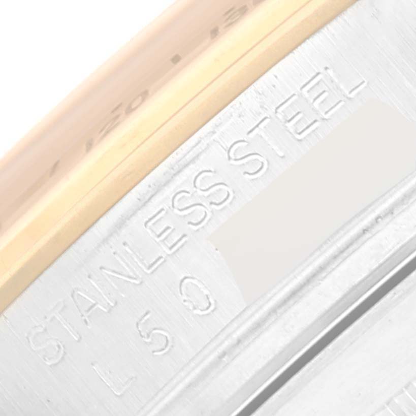 This image shows a close-up angle of the case side of a Rolex Daytona 16523 Men's Steel and Gold (two tone) Champagne Dial 16523 Men's Steel and Gold (two tone) Champagne Dial watch, highlighting the "Stainless Steel" engraving.