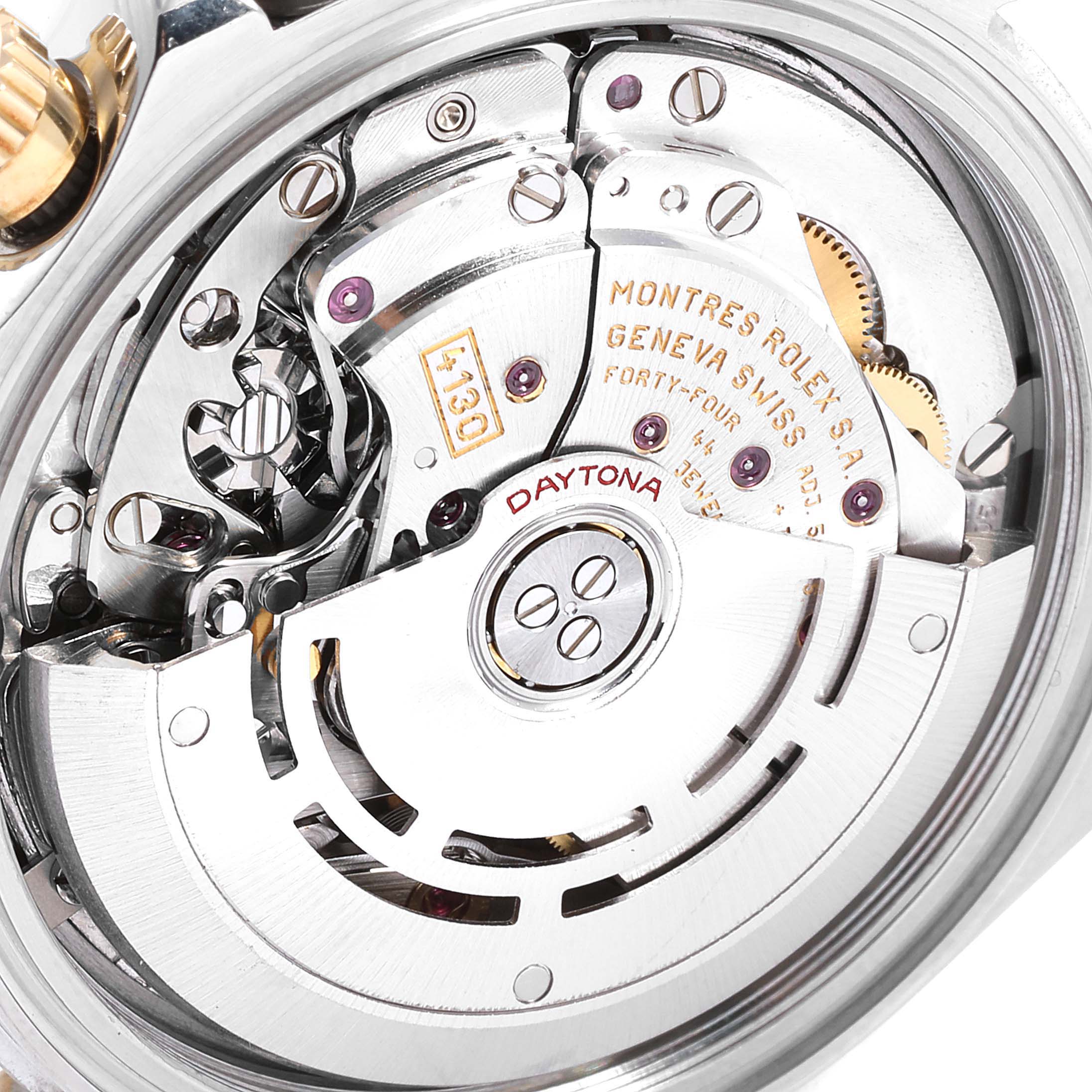The image shows the movement mechanism of a Rolex Daytona 116523 Men
s Steel and Gold (two tone) Grey Dial 116523 Men
s Steel and Gold (two tone) Grey Dial watch from a close-up, internal angle.