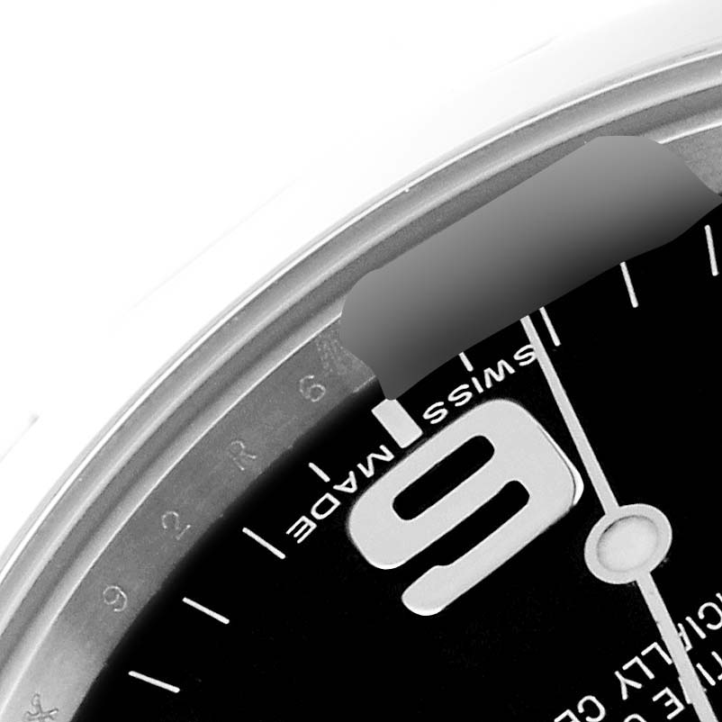 The image shows a close-up of the dial and bezel of the Rolex Explorer 214270 Men
s Stainless Steel Black Dial 214270 Men
s Stainless Steel Black Dial watch, focusing on the "6" numeral and "Swiss Made" text.
