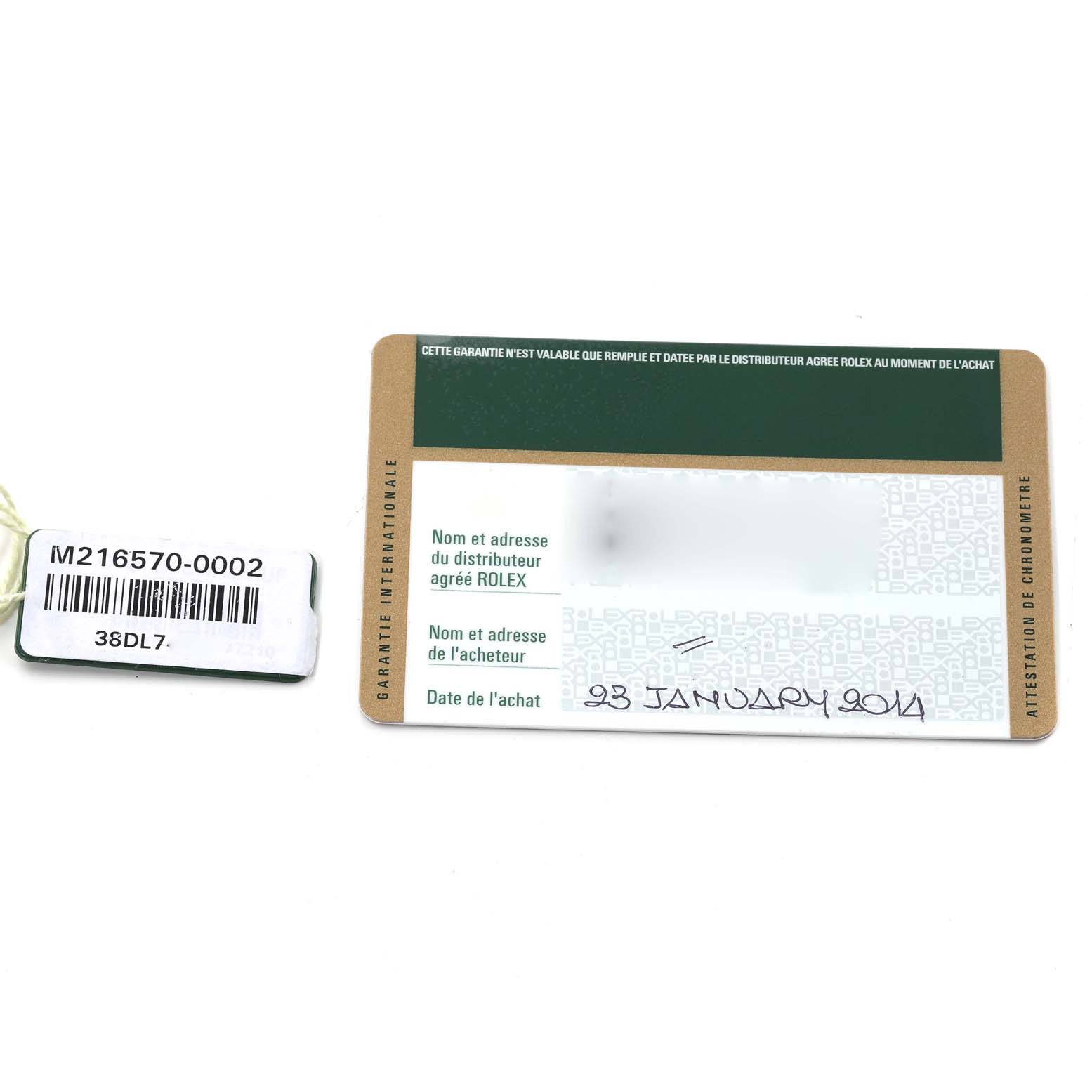 The image shows a hangtag with the reference number and a warranty card for the Explorer model by Rolex.