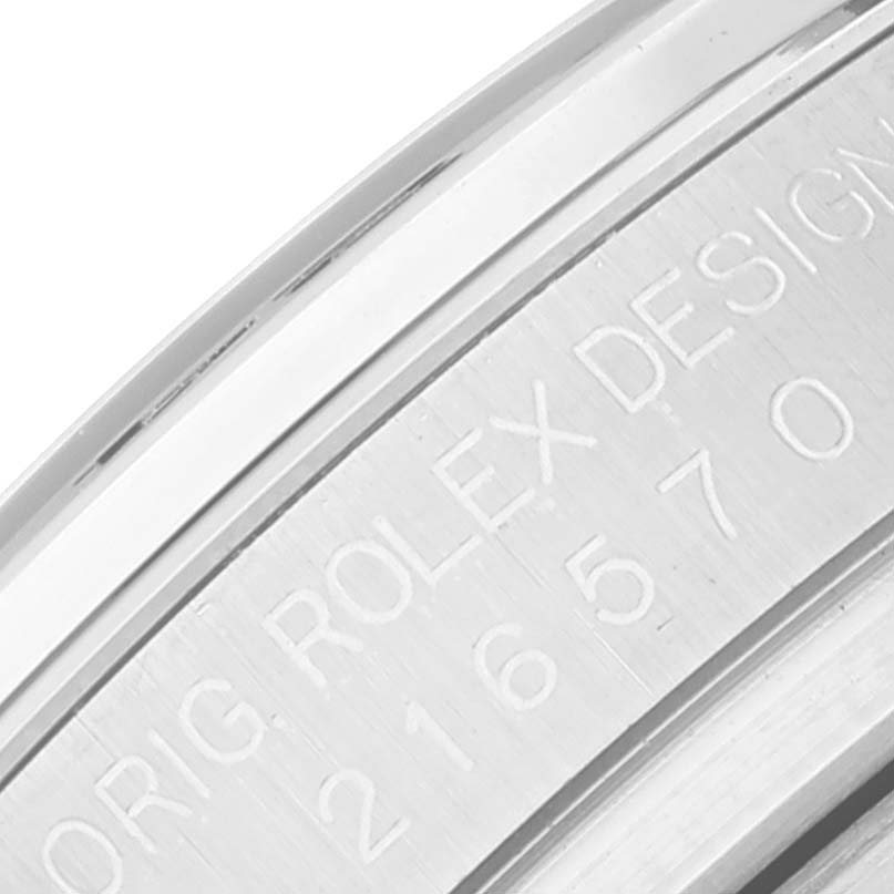 This image shows a close-up view of the engraved case band of the Rolex Explorer 216570 Men
s Stainless Steel White Dial 216570 Men
s Stainless Steel White Dial watch.