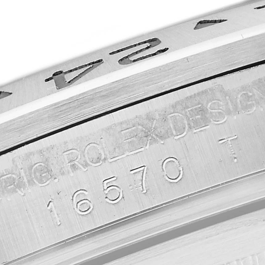 This close-up image of the Rolex Explorer 16570 Men
s Stainless Steel Black Dial 16570 Men
s Stainless Steel Black Dial shows the model number and Rolex engraving on the watch case.