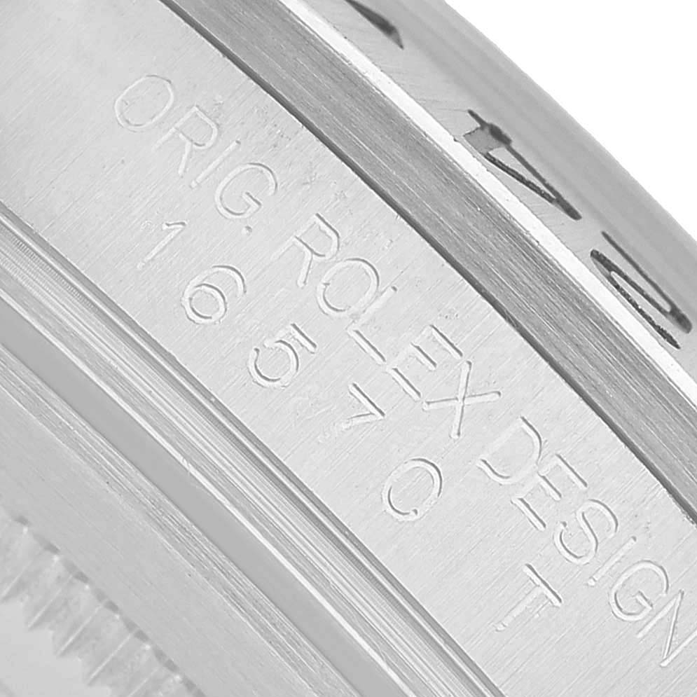 The image shows a close-up of the side of the Rolex Explorer 16570 Men's Stainless Steel Black Dial watch case, highlighting engraved model details.