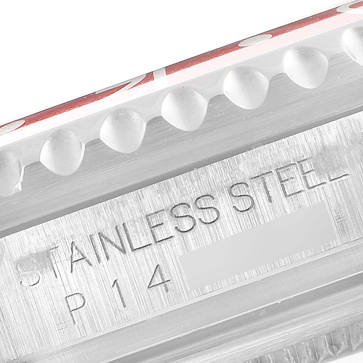 The image shows a close-up of the stainless steel bezel and engraving on the side of a Rolex GMT-Master 16710 Men's Stainless Steel Black Dial 16710 Men's Stainless Steel Black Dial watch.