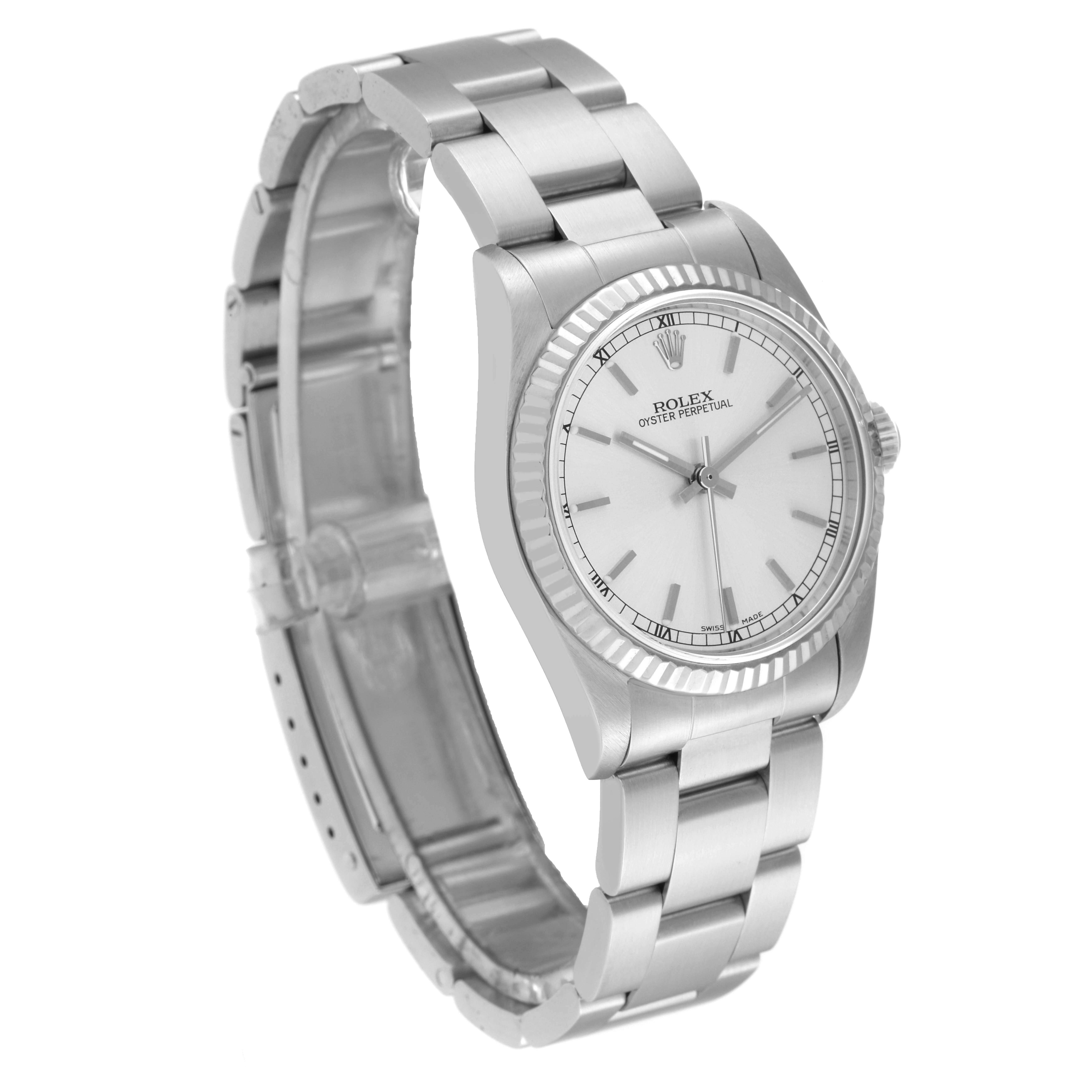 The image shows a side angle of a Rolex Mid-Size 77014 Women
s Stainless Steel Silver Dial 77014 Women
s Stainless Steel Silver Dial Oyster Perpetual, featuring the watch face, bezel, and bracelet.