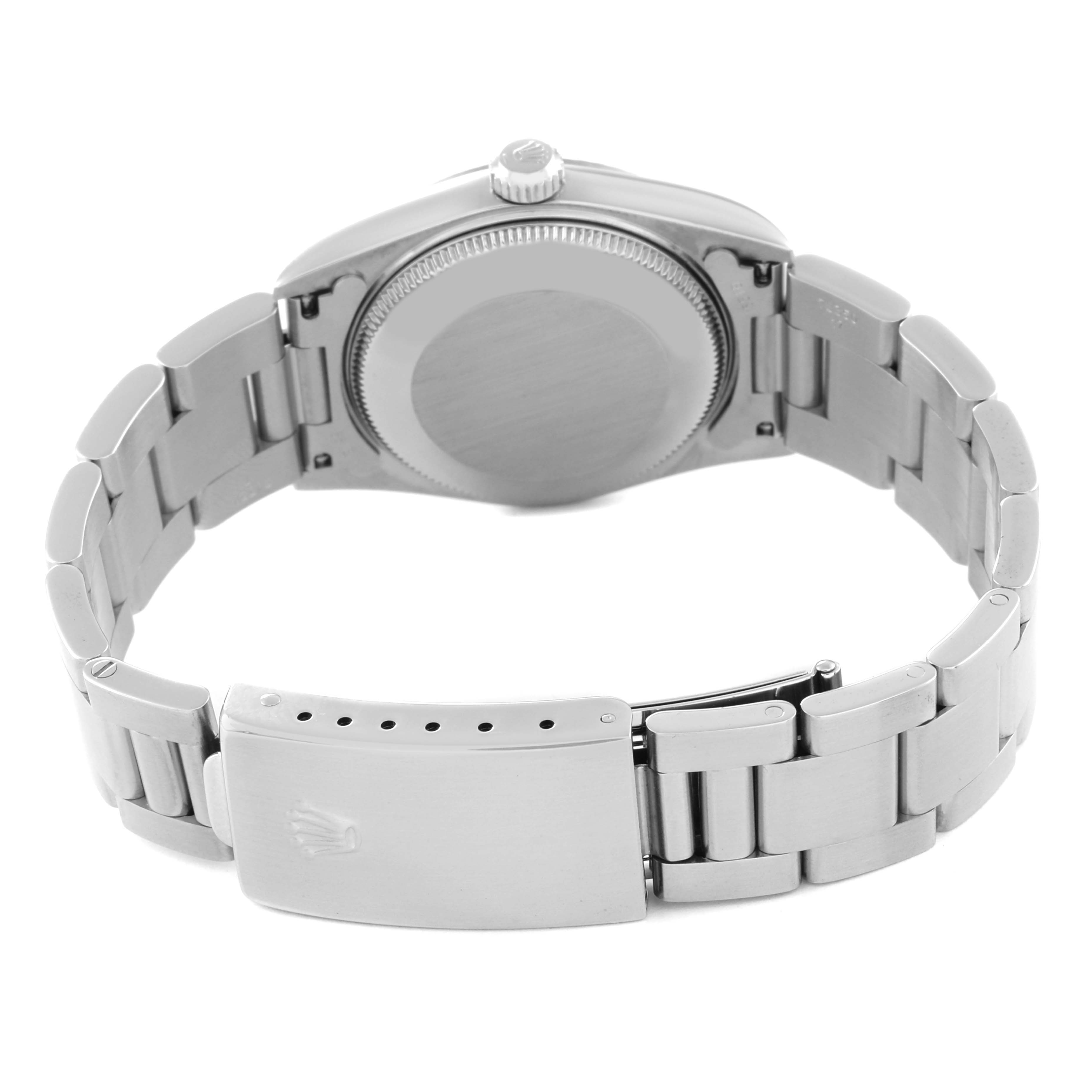 The image shows the back case and bracelet clasp of a Rolex Mid-Size 77014 Women
s Stainless Steel Silver Dial 77014 Women
s Stainless Steel Silver Dial watch.