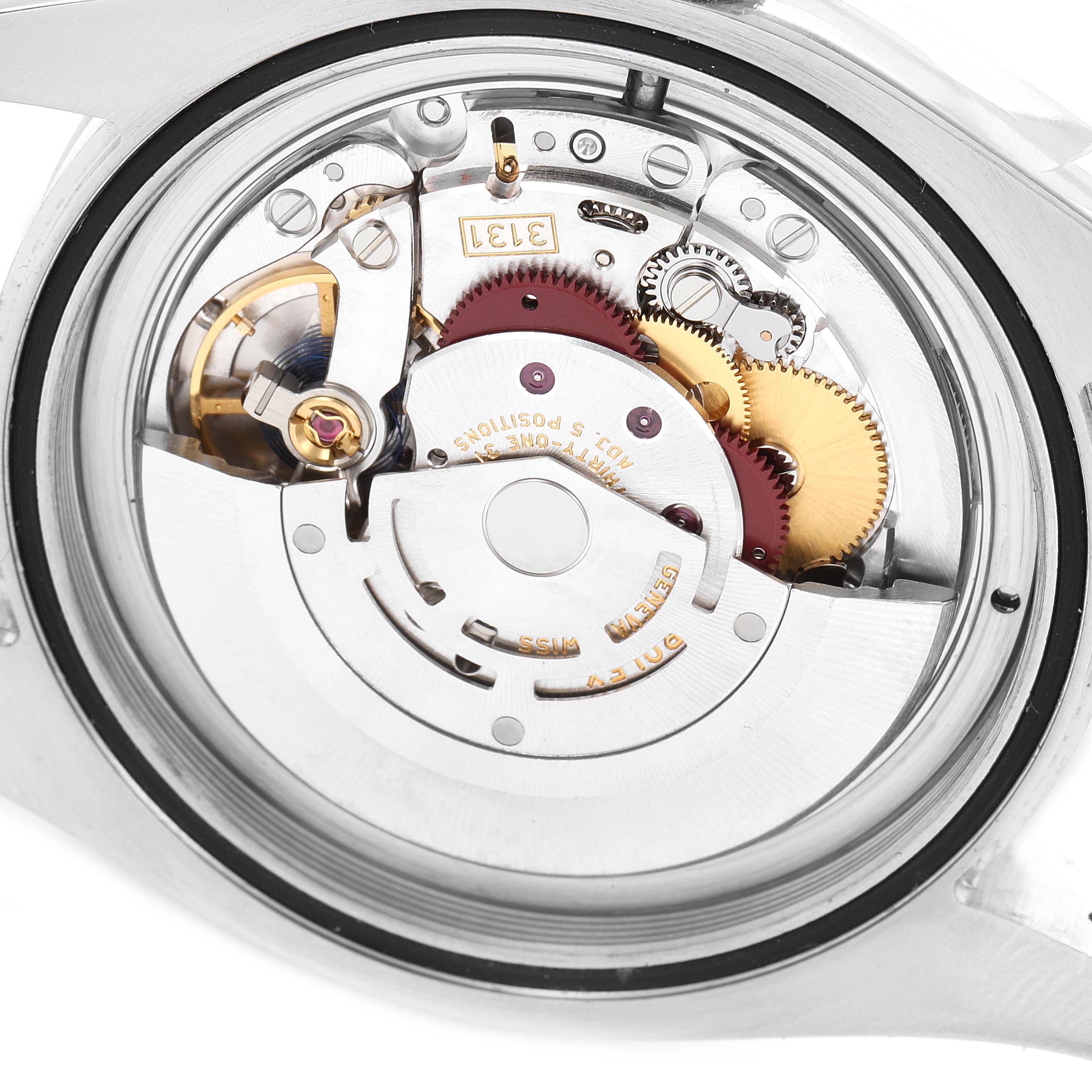 The image shows the mechanism and movement parts of a Rolex Milgauss 116400GV Men
s Stainless Steel Blue Dial 116400GV Men
s Stainless Steel Blue Dial watch from a rear angle with the case back removed.