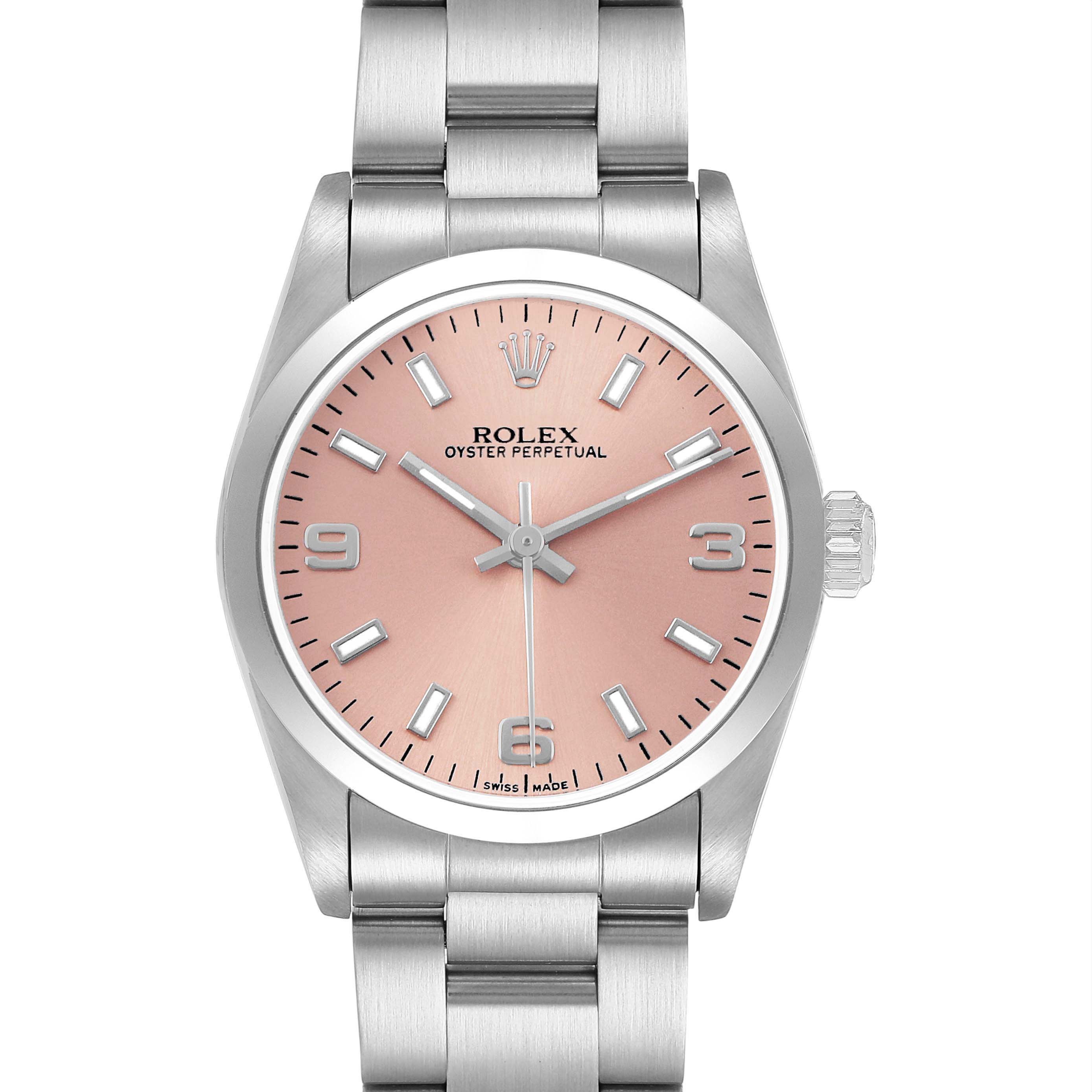 The Rolex Oyster Perpetual 77200 Women's Stainless Steel Pink Dial watch is shown from a front angle, displaying the face, bezel, crown, and bracelet.