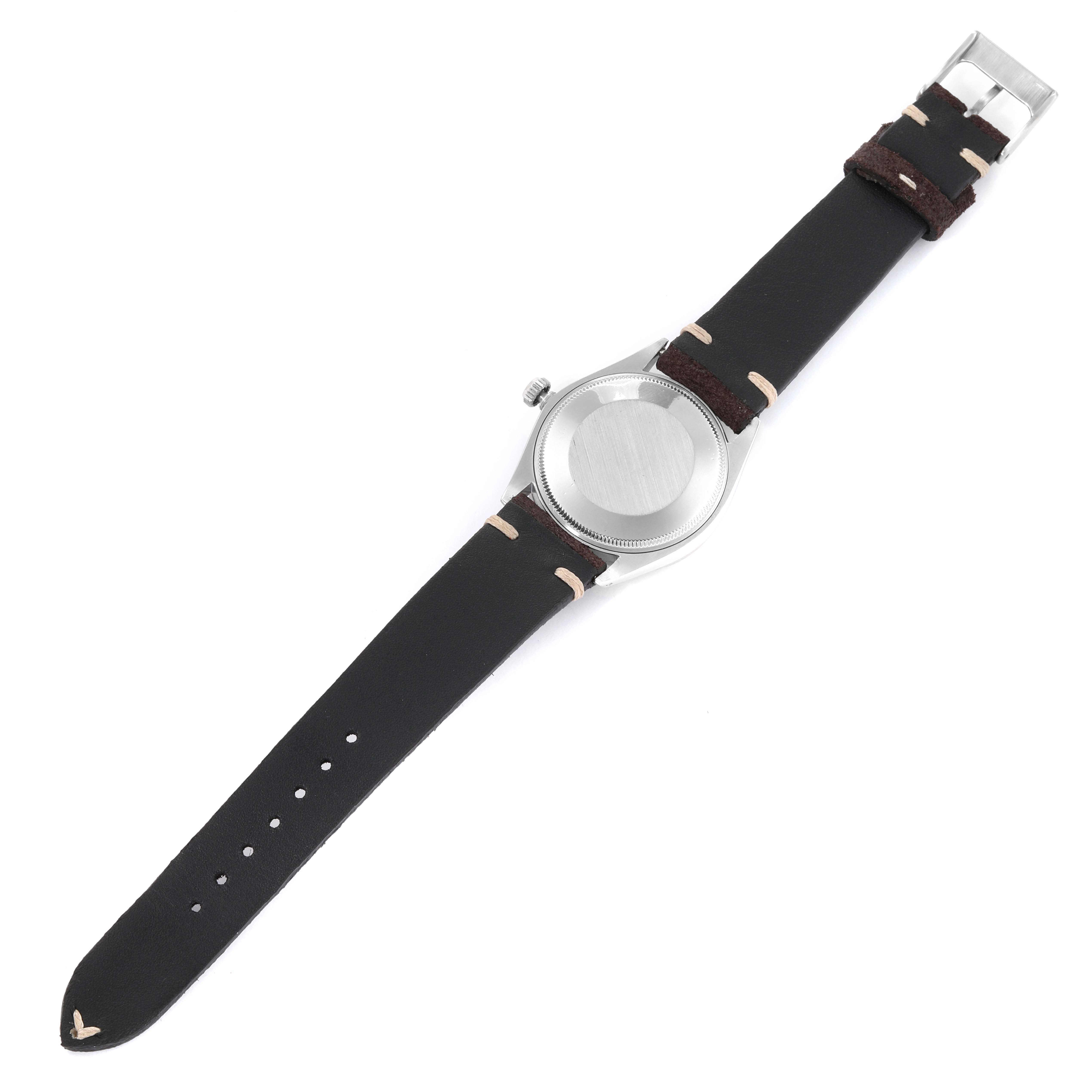 The image shows the back case and strap of a Rolex Vintage Collection 1007 Men's Stainless Steel Silver Dial 1007 Men's Stainless Steel Silver Dial model watch, viewed from the bottom side.