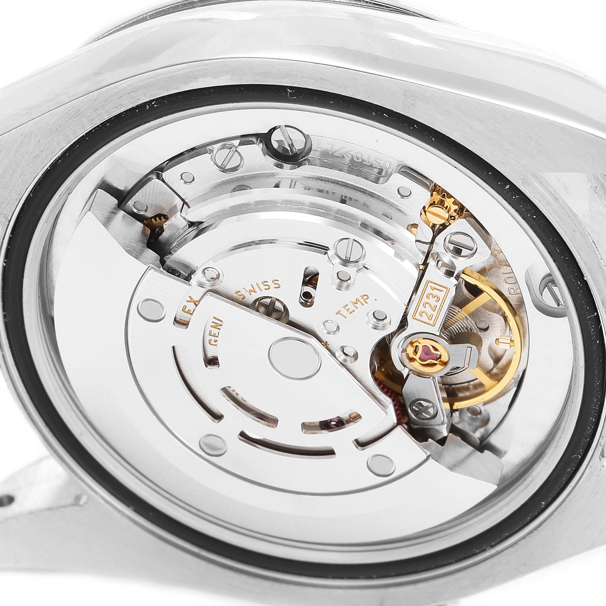 This image shows an up-close view of the internal movement of a Mid-Size Rolex watch.