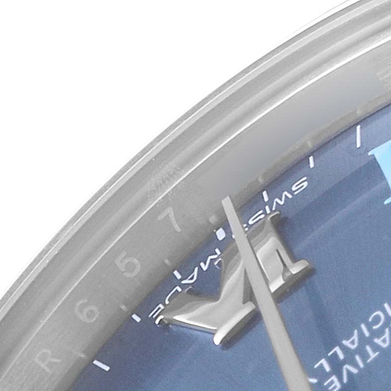 This close-up shows the blue dial, central hands, and part of the bezel of the Rolex Mid-Size 177200 Women
s Stainless Steel Blue Dial 177200 Women
s Stainless Steel Blue Dial watch.