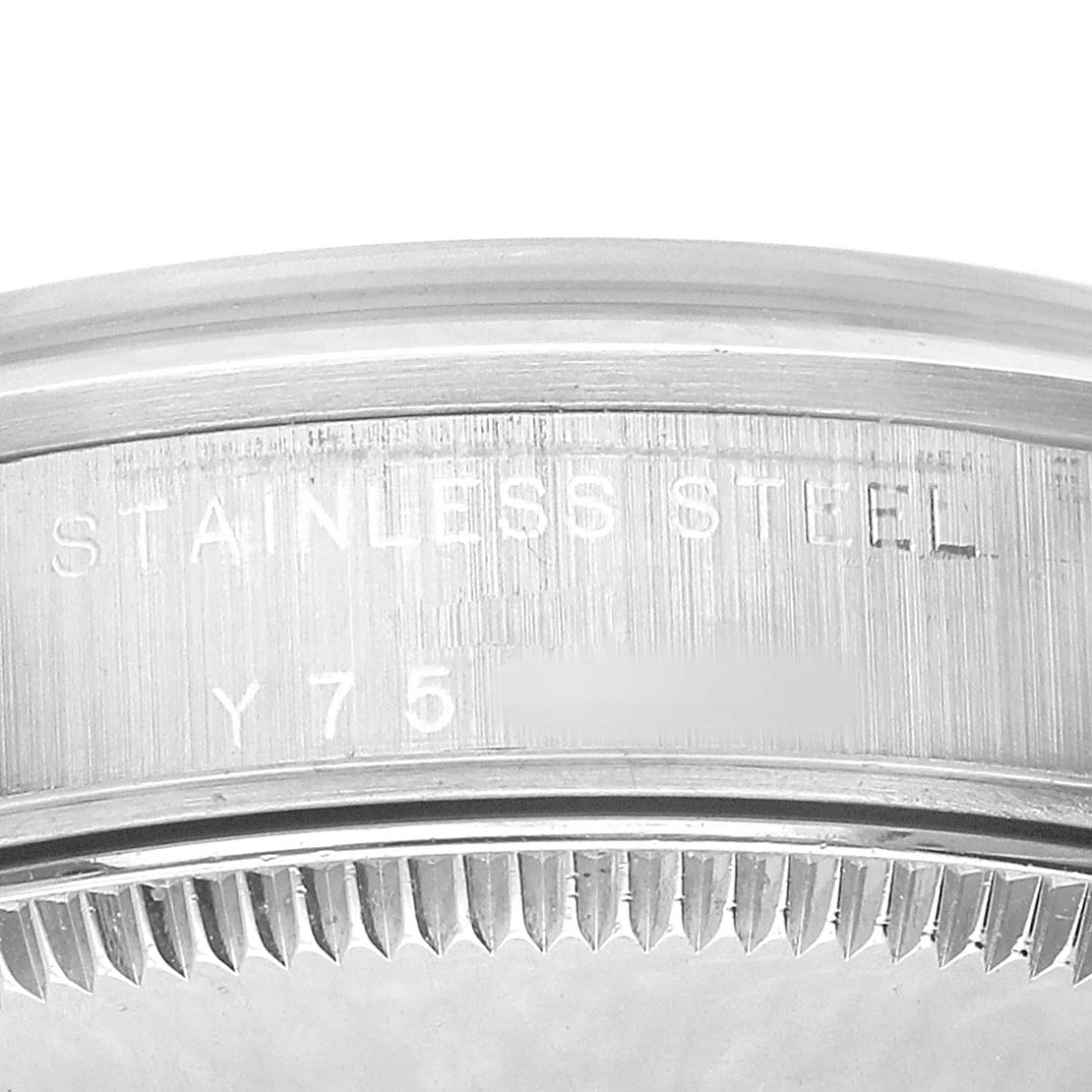 The image shows a close-up of the stainless steel case back of a Rolex Oyster Perpetual 77080 Women's Stainless Steel Black Dial watch.