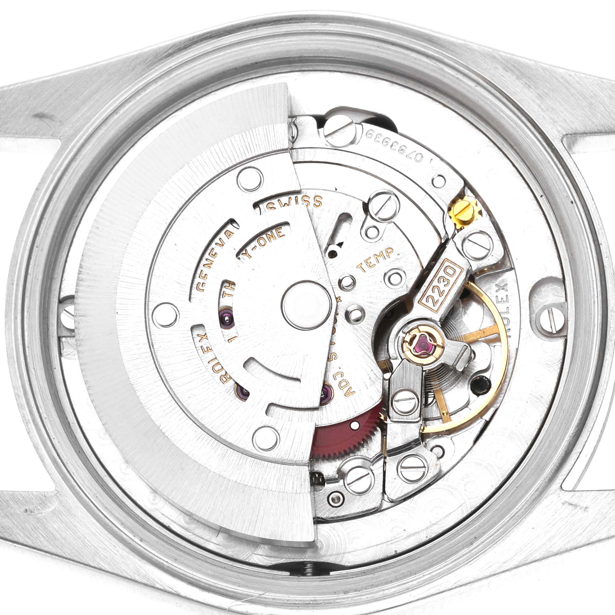 The image shows the movement of a Rolex Oyster Perpetual 77080 Women's Stainless Steel Black Dial watch from a top-down angle, highlighting its intricate components.