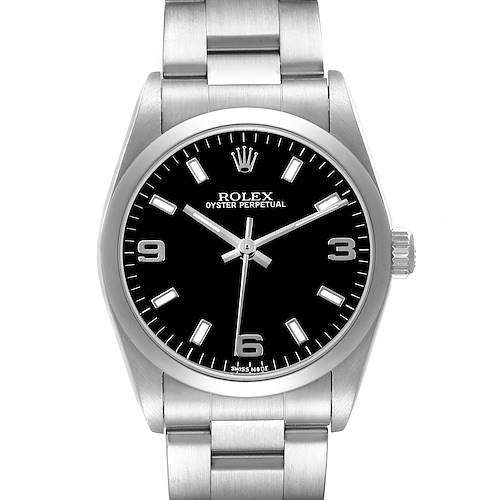 The image shows a front view of the Rolex Oyster Perpetual 77080 Women's Stainless Steel Black Dial watch, highlighting its black dial, hands, and stainless steel bracelet.