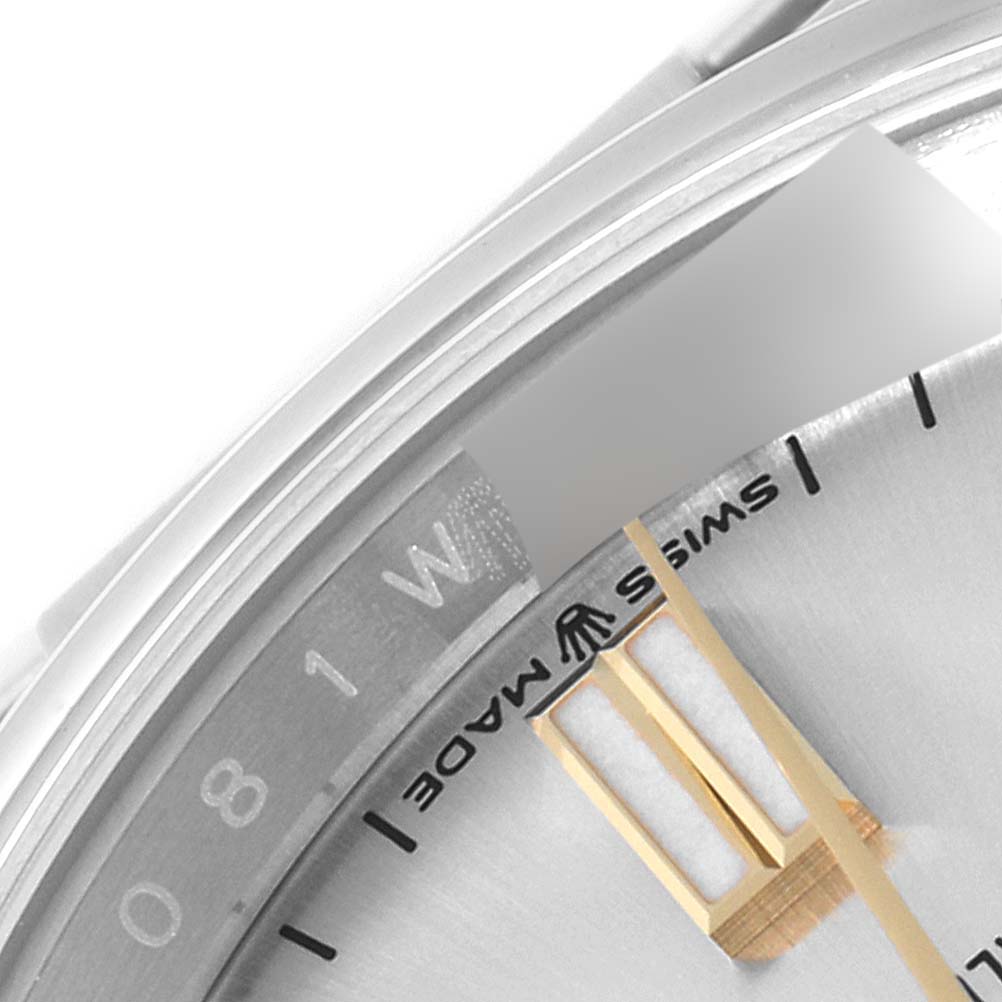 The image shows a close-up of the dial and part of the bezel of a Rolex Oyster Perpetual 126000 Men's Stainless Steel Silver Dial 126000 Men's Stainless Steel Silver Dial watch, highlighting the "Swiss Made" inscription.