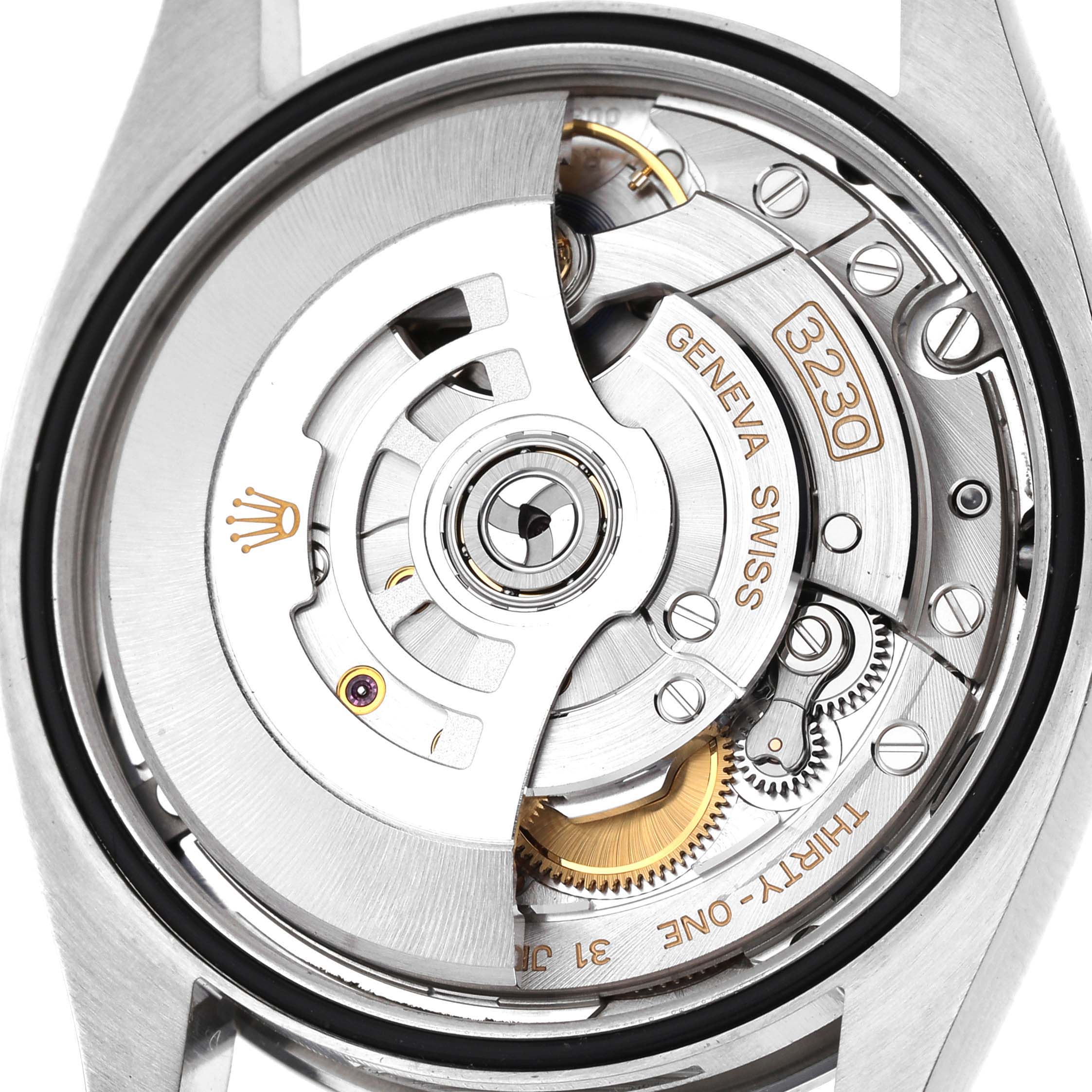 The image shows the back view of a Rolex Oyster Perpetual 126000 Men's Stainless Steel Black Dial, highlighting its intricate movement mechanism.