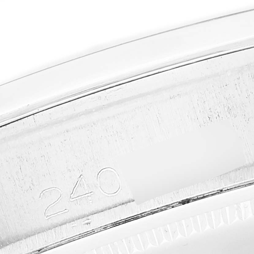 This image shows a close-up of the engraved serial number on the case of a Rolex Vintage Collection 6694 Men's Stainless Steel Silver Dial 6694 Men's Stainless Steel Silver Dial watch.