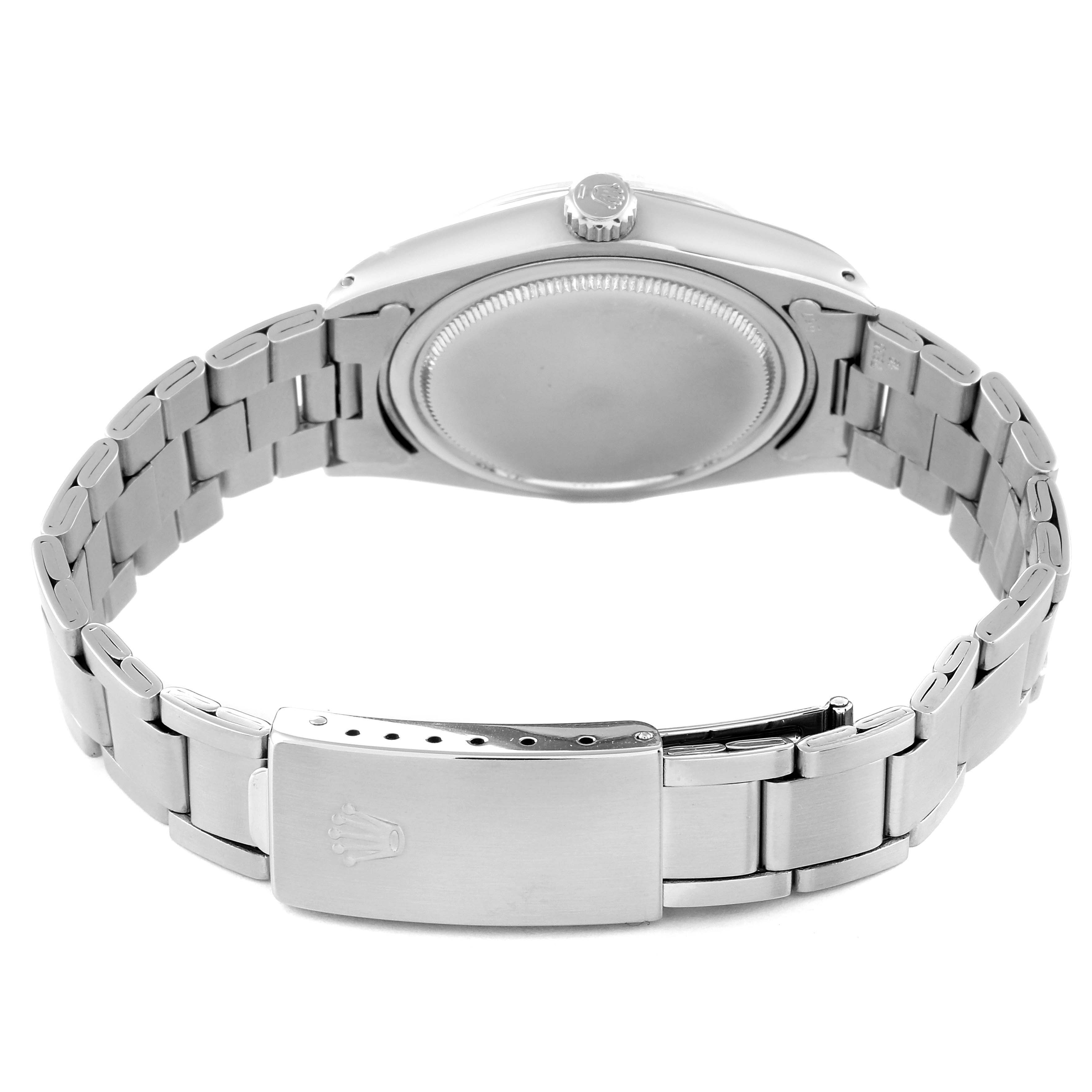 The image shows the back of a Rolex Vintage Collection 6694 Men's Stainless Steel Silver Dial 6694 Men's Stainless Steel Silver Dial model watch, focusing on the case back, crown, and bracelet clasp.