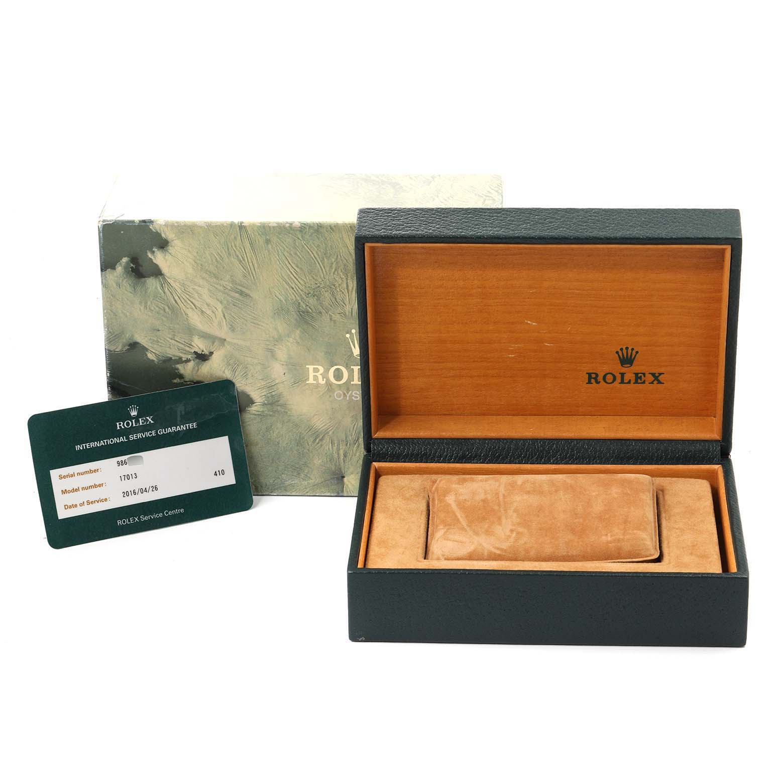 The image shows a Rolex Oysterquartz 17013 Men's Steel and Gold (two tone) Champagne Dial 17013 Men's Steel and Gold (two tone) Champagne Dial watch box, its outer box, and an international service guarantee card.
