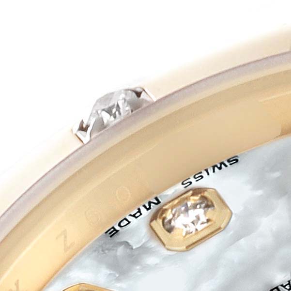 The image shows a close-up of the bezel and part of the dial of a Rolex Pearlmaster 80318 Women's Yellow Gold Mother of Pearl Dial 80318 Women's Yellow Gold Mother of Pearl Dial, highlighting the "Swiss Made" marking and diamond markers.