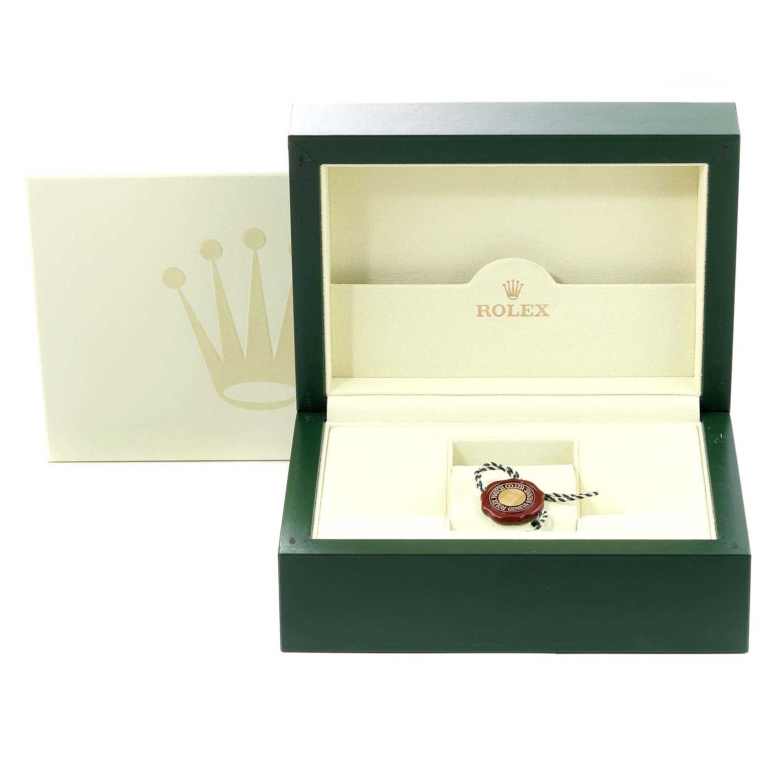 The image shows an open green Rolex box with a tag, designed for the Pearlmaster model by Rolex.