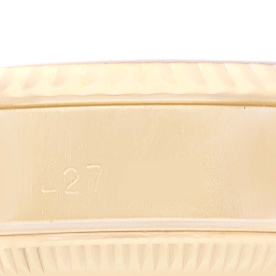 This image shows the side edge with an engraving of the watch case of the Rolex President 69178 Women's Yellow Gold Blue Dial 69178 Women's Yellow Gold Blue Dial model.