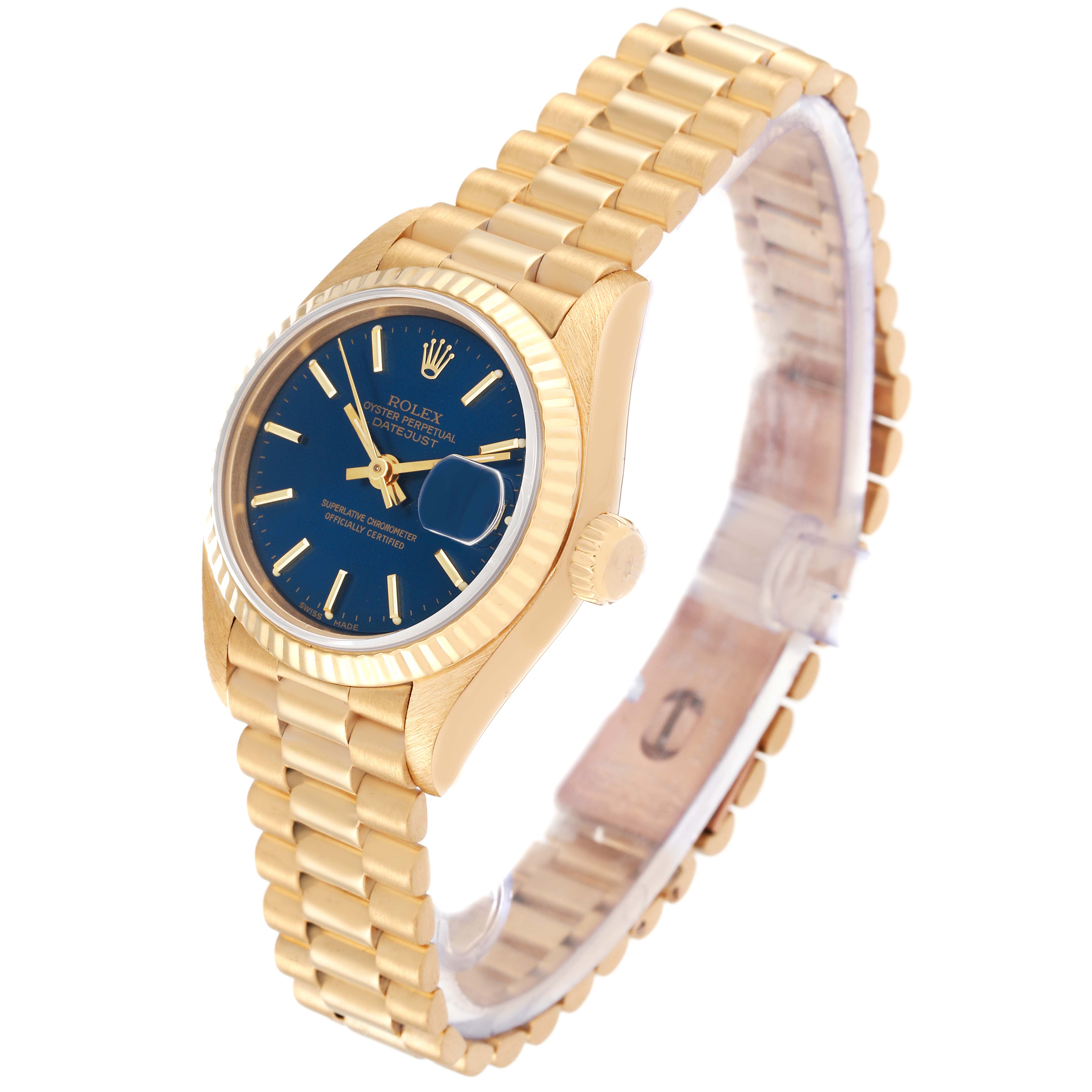 The image shows a Rolex President 69178 Women's Yellow Gold Blue Dial 69178 Women's Yellow Gold Blue Dial model watch at an angled side view, highlighting the gold band, blue dial, and fluted bezel.