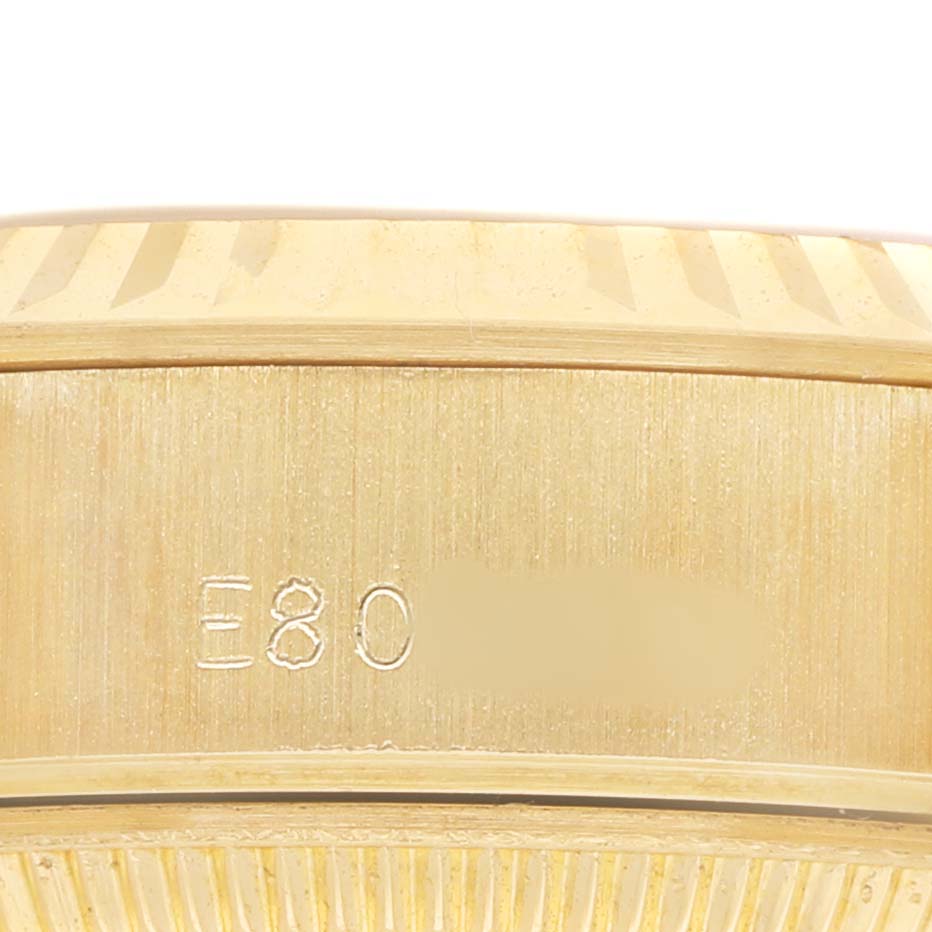The image shows the side view of the Rolex President 69178 Women's Yellow Gold Champagne Dial model, focusing on the case edge with serial engraving.