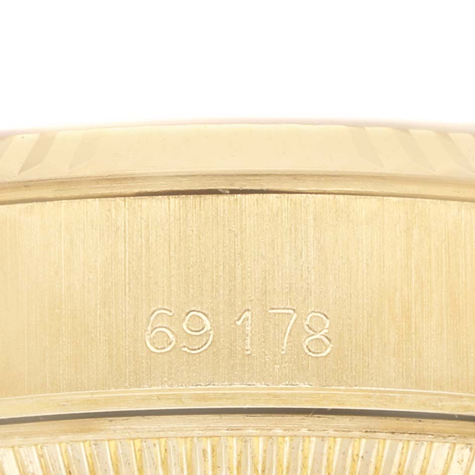 The image shows a close-up of the model number engraving (69178) on the case side of a Rolex President 69178 Women's Yellow Gold Champagne Dial watch.