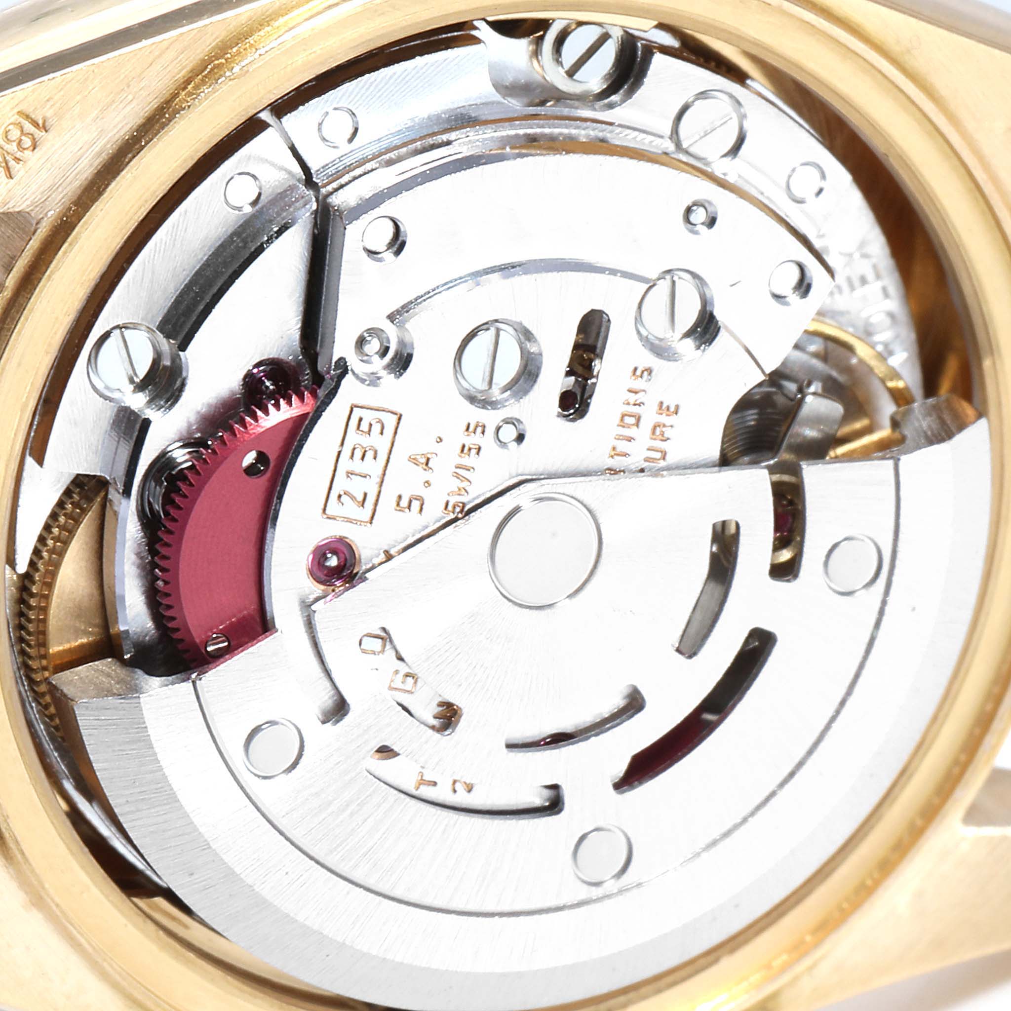 The image shows a close-up of the movement mechanism inside a Rolex President 69258 Women
s Yellow Gold Champagne Dial 69258 Women
s Yellow Gold Champagne Dial watch.
