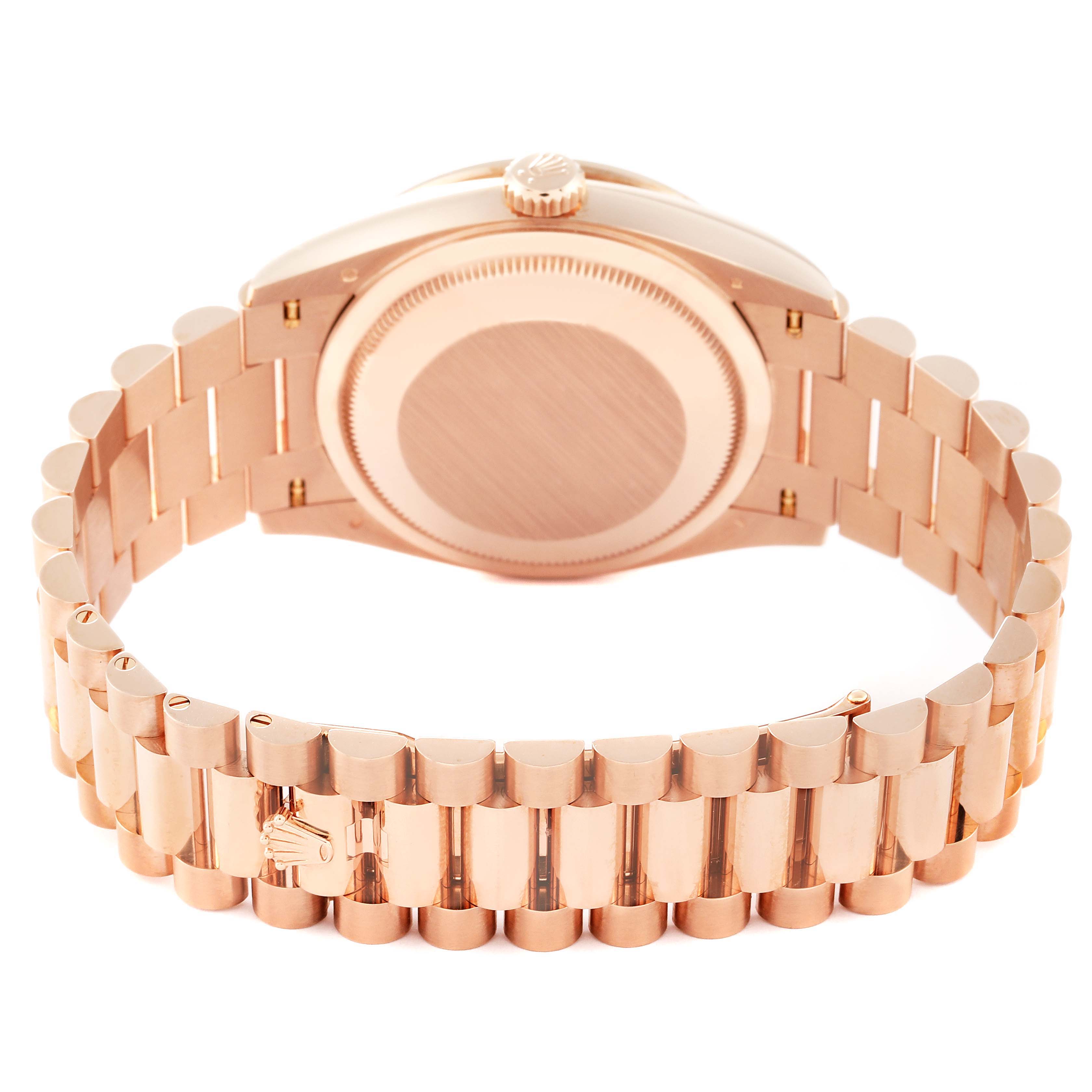 This image shows the back view of a Rolex President 128345RBR Men's Rose Gold Brown Dial 128345RBR Men's Rose Gold Brown Dial model watch, highlighting its bracelet and case back.