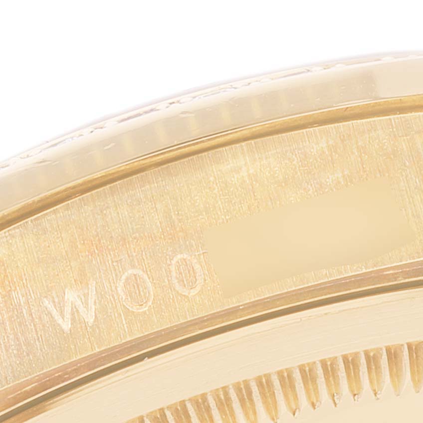 This image shows a close-up of the case back and part of the bracelet of a Rolex President 18338 Men
s Yellow Gold Champagne Dial 18338 Men
s Yellow Gold Champagne Dial model watch.